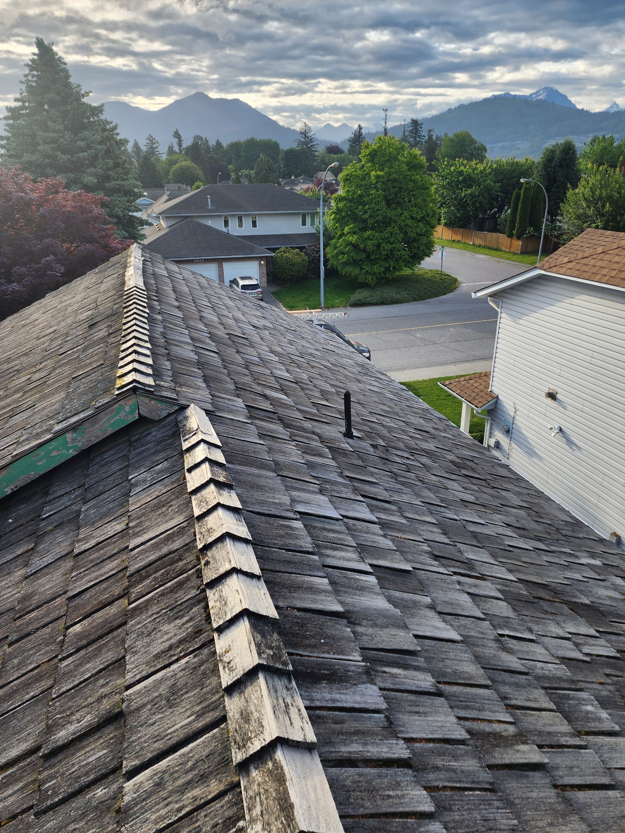 Residential Cedar ReRoofing Installation using OC Oakridge shingles by Top Notch Roofing Inc