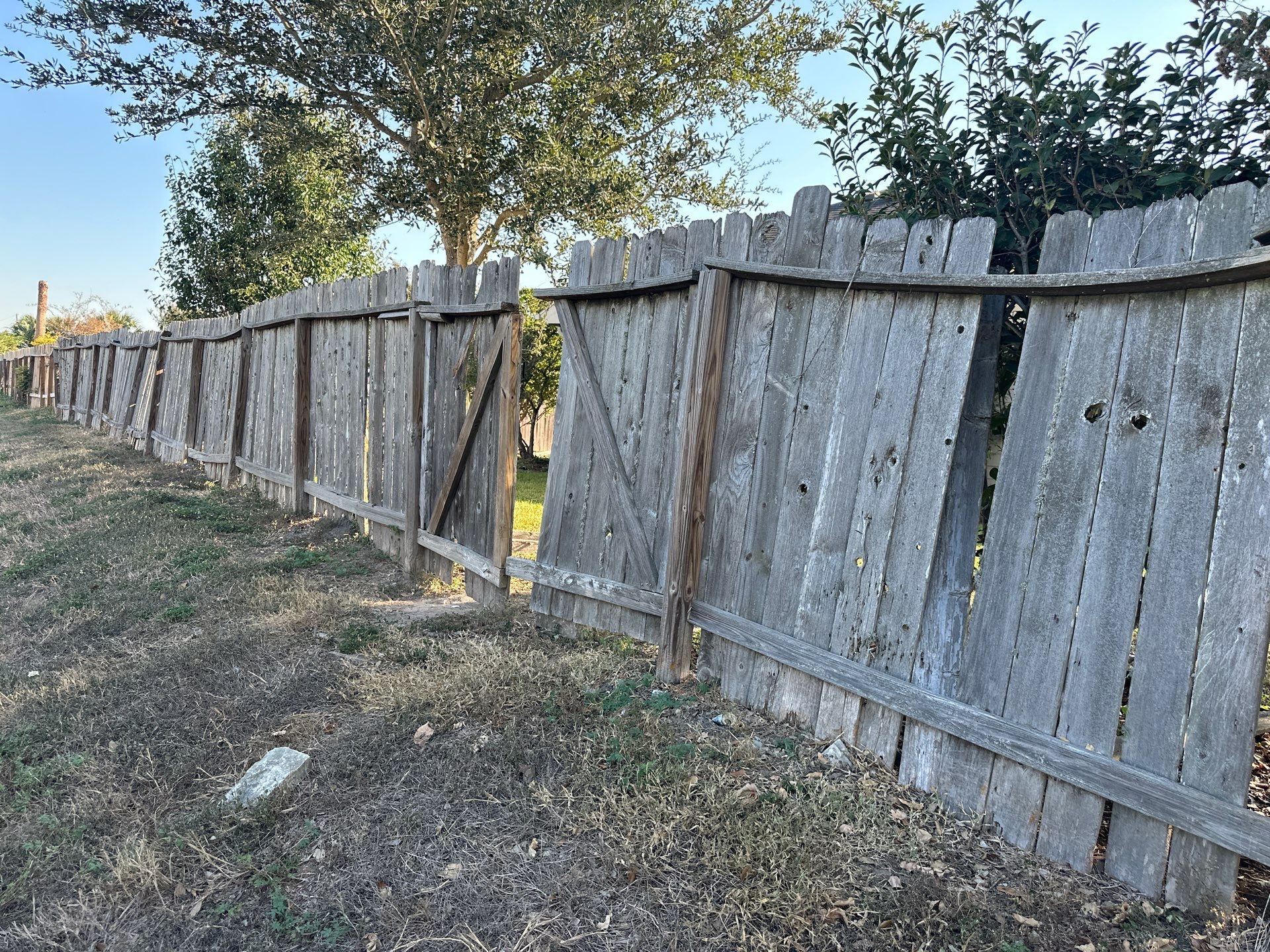Beautiful Wood fence with metal posts by Tim's Fences