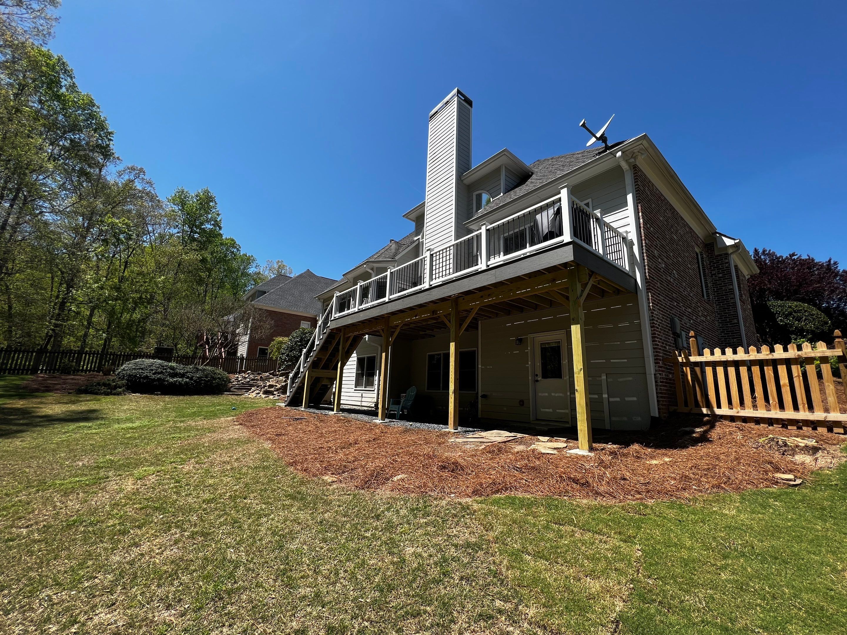 Elevated Grey Composite Deck Installation in Woodstock by Swift Home Renovations 