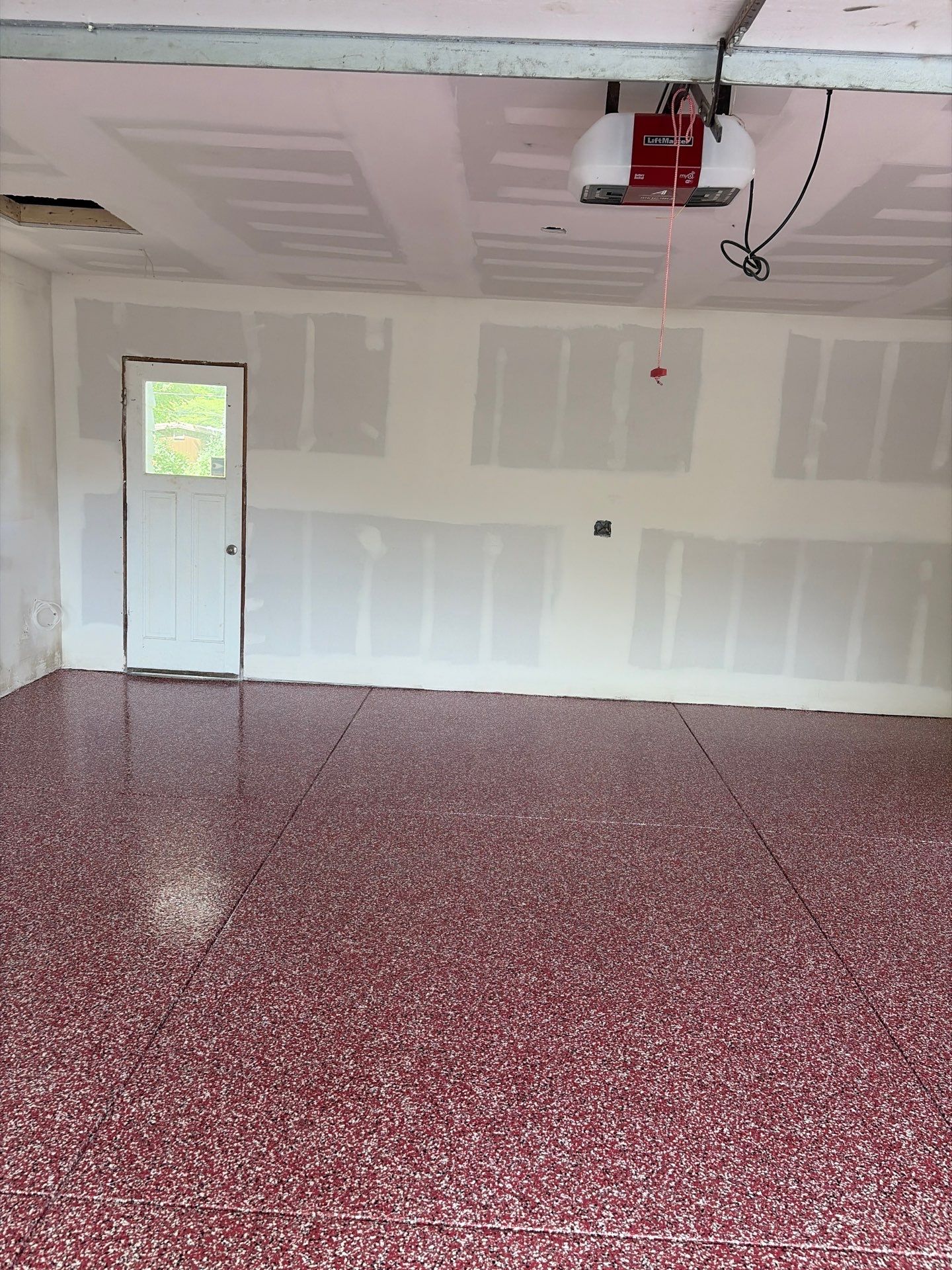 Bayside Garage Interior Remodel with Custom Epoxy Floor Coating by OCS Contracting Services
