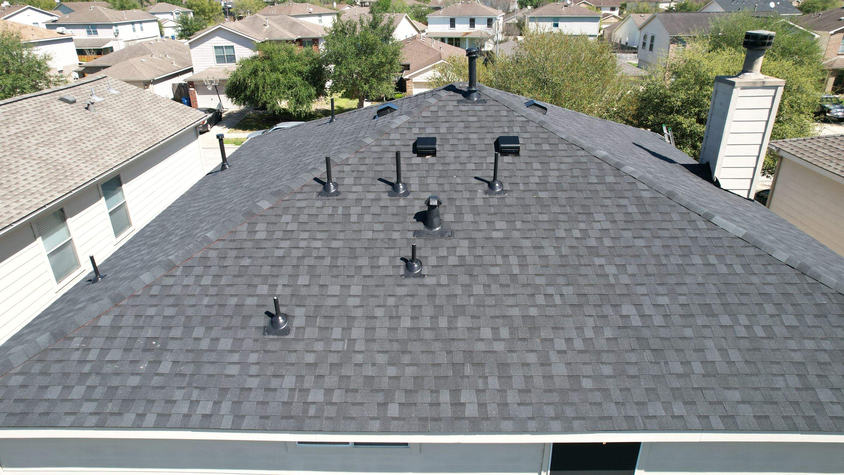 Complete Charcoal-Gray Roof Replacement — Spring, TX by PL Roofing & SB Roofing, LLC.