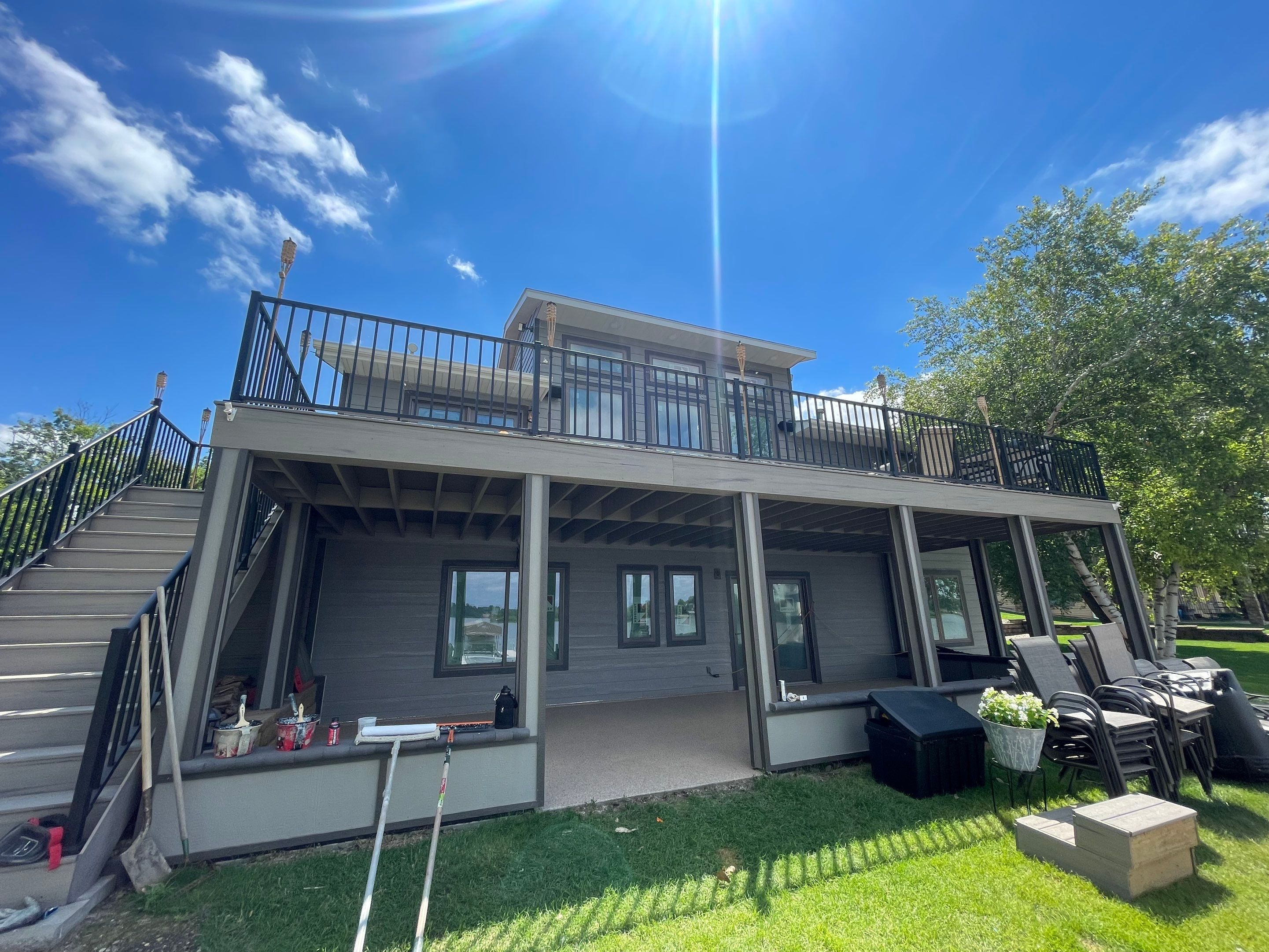 Lakefront Screened Patio Concrete Coating Installation in Wentworth by Select Painting, Coatings & Garage Cabinets