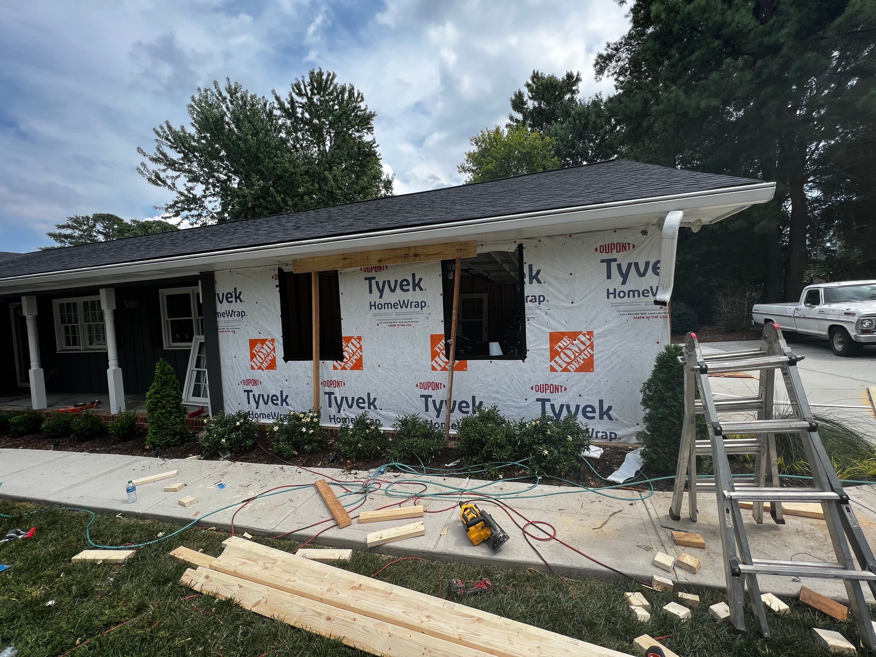 Snellville Garage Remodel Featuring Epoxy Floors and Board and Batten Siding by Swift Home Renovations