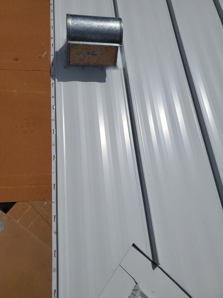 Residential Roofing Installation using 1.5" Nail Strip 24ga Solar White Kynar Coated Standing Seam Metal Panels by Morton Roofing, Inc.