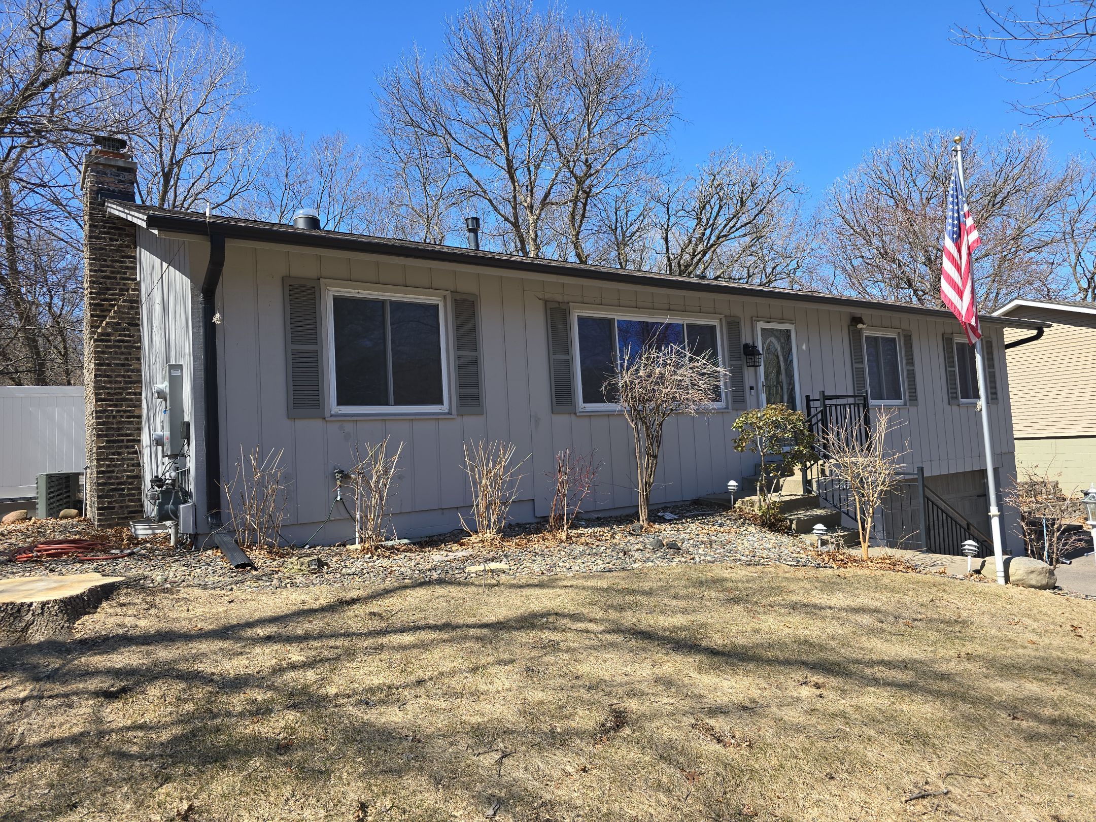 Premium Exterior Remodel – Alside Charter Oak Siding, Hayfield Black Frame Windows, Edco Soffit & Fascia by First Impressions Exteriors