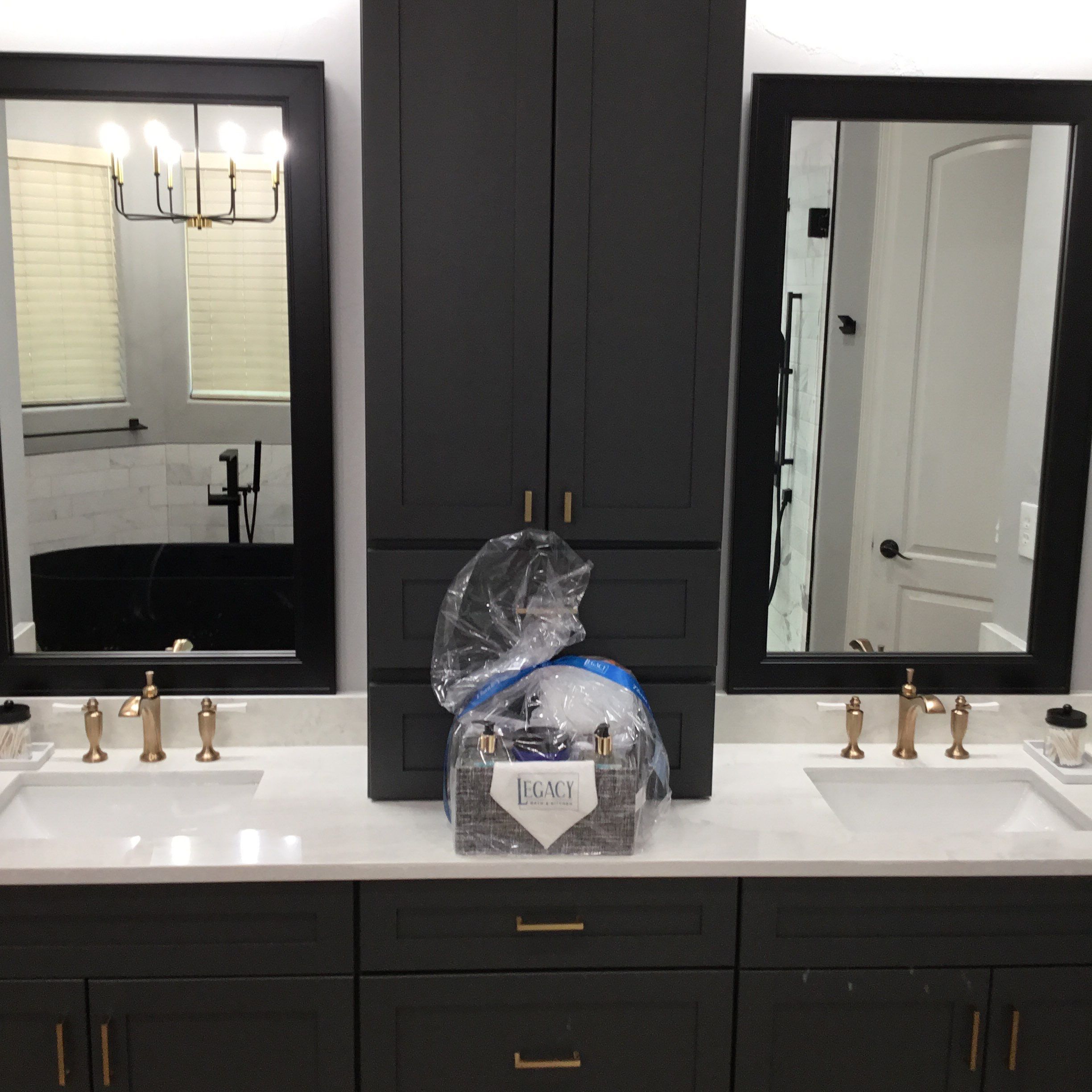 Spring Bathroom Remodel with Black Free-Standing Tub and Walk-In Shower by Legacy Bath and Kitchen