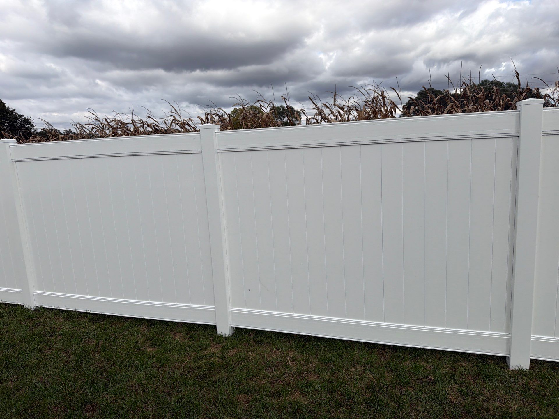 Residential White Vinyl Privacy Fence Installation in Janesville by Perfect Picket Fence and Stain