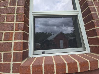 Close up of window frame on brick wall