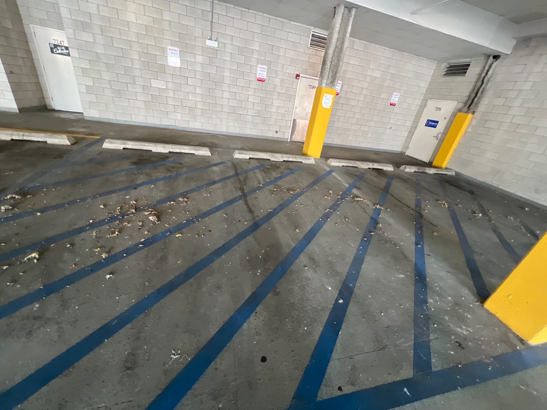 Parking garage using Hot water by Northern Power Washing LLC.
