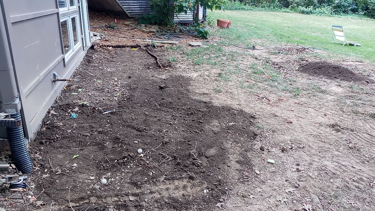 Back Yard Cantilivered Patio by LAND ESCAPES LLC
