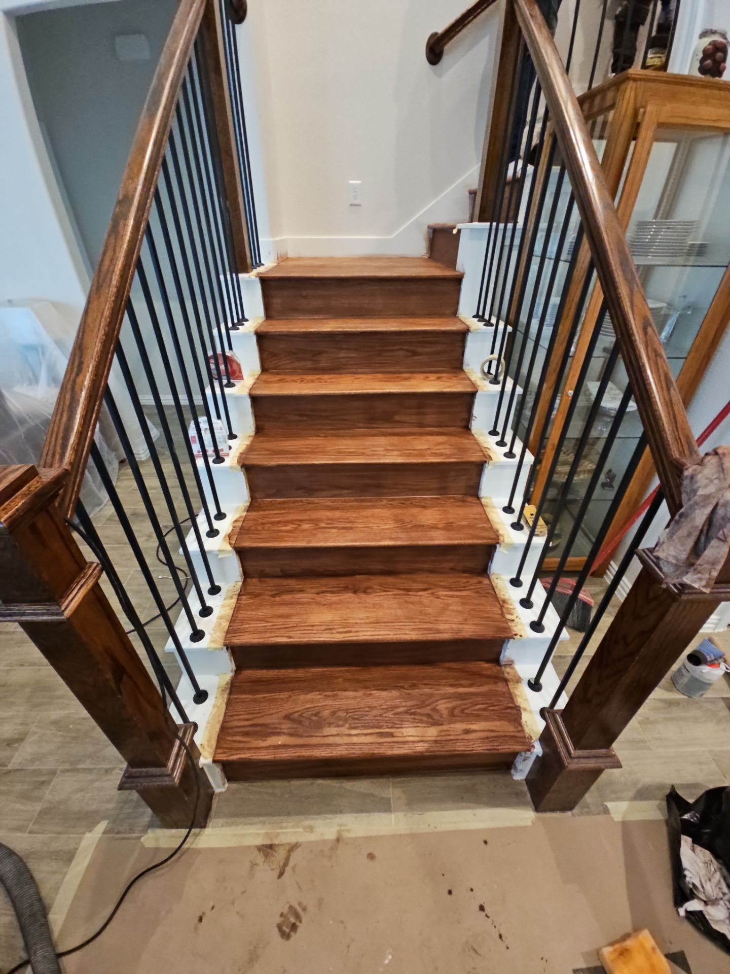 Carpet replacement with Tile and Red Oak Stairs by EL-GC LLC 