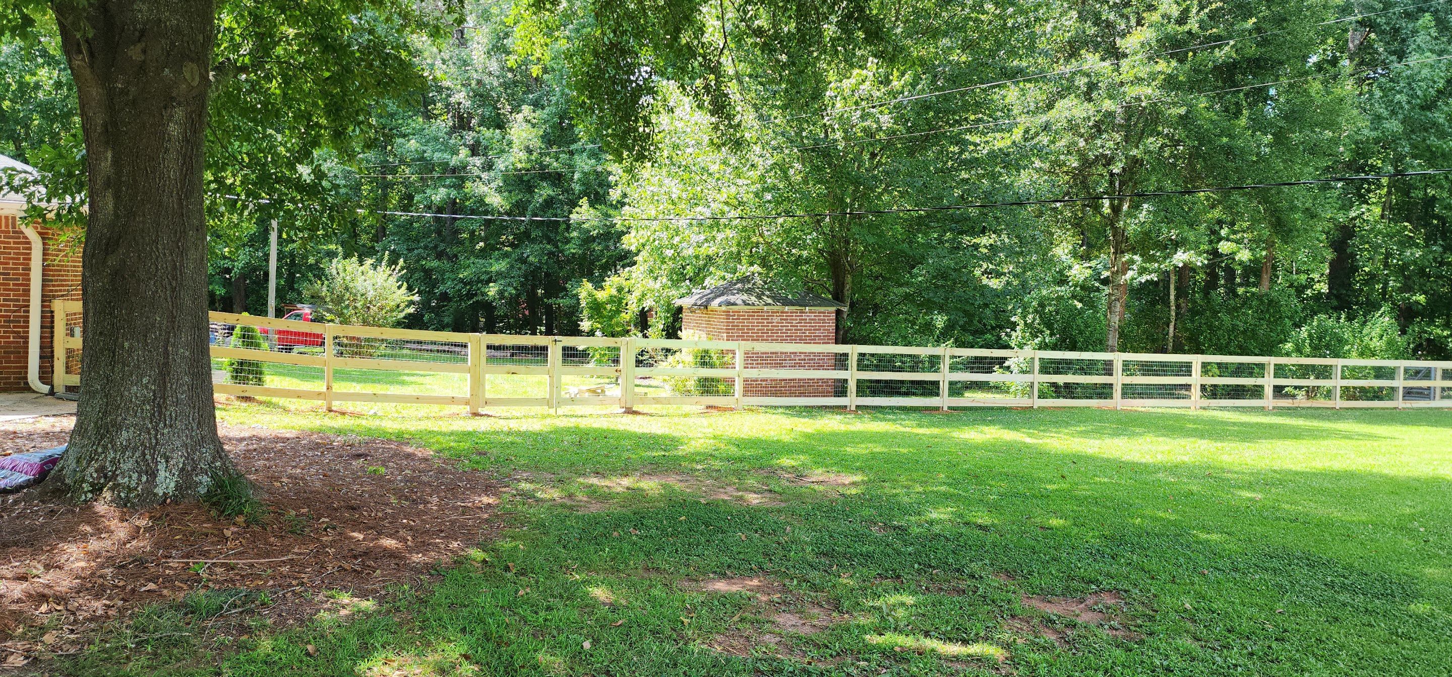 Fence Installation of 3 Rail Ranch with Wire Backing by Titans of Timber Fence & Stain
