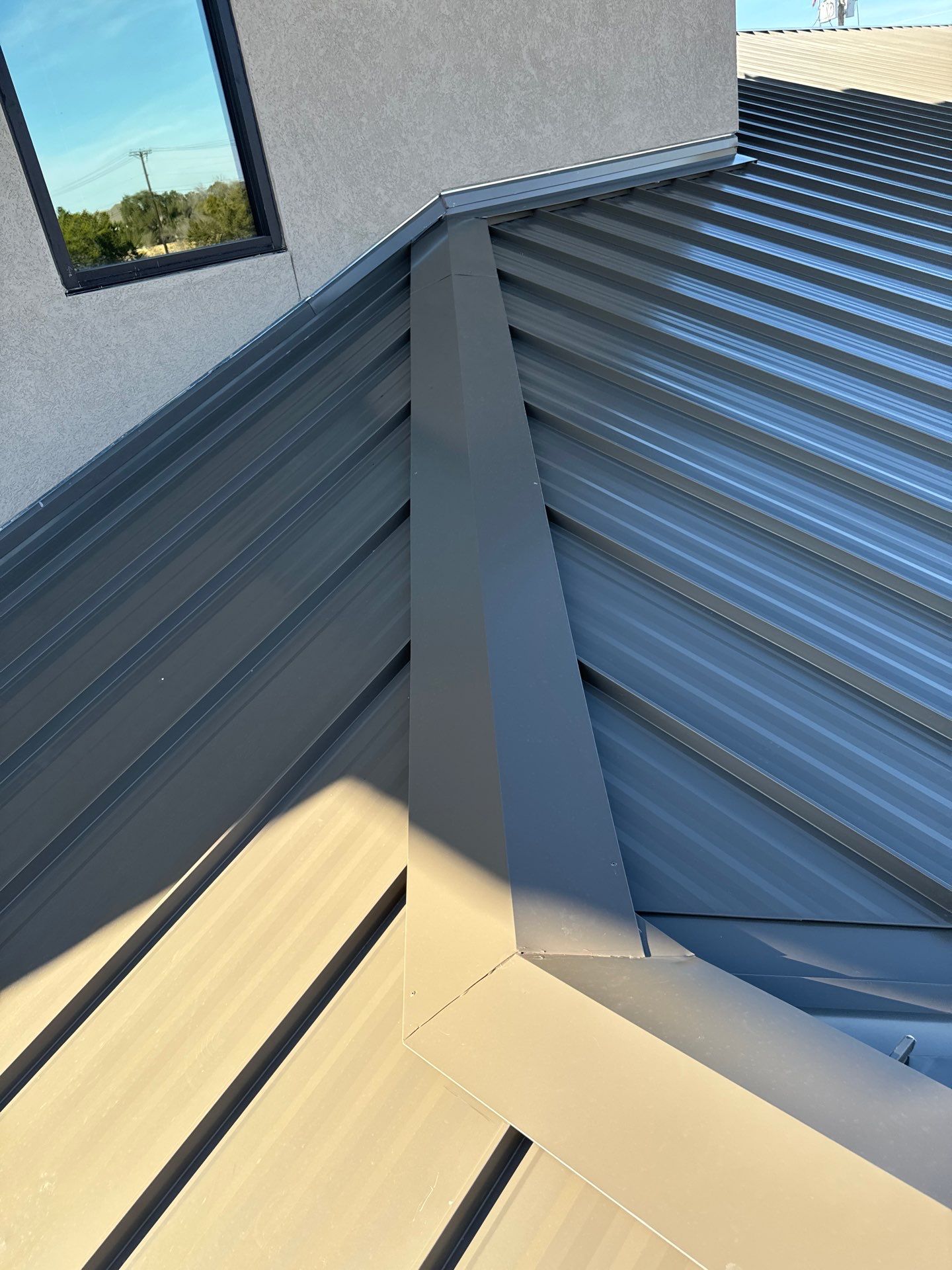 Commercial Roofing Installation using 24 GA Standing Seam by Action Exteriors Austin