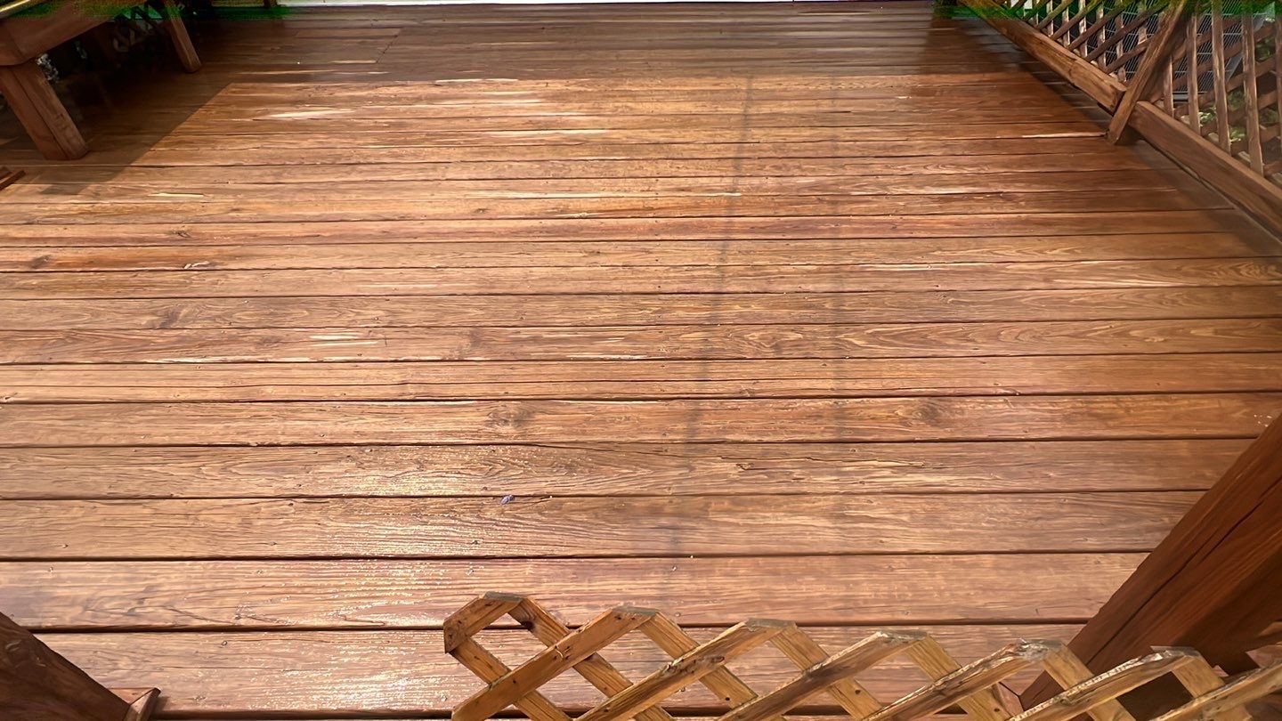 Wood cleaning and staining using Armstrong cloark oil stain by Northern Power Washing LLC.