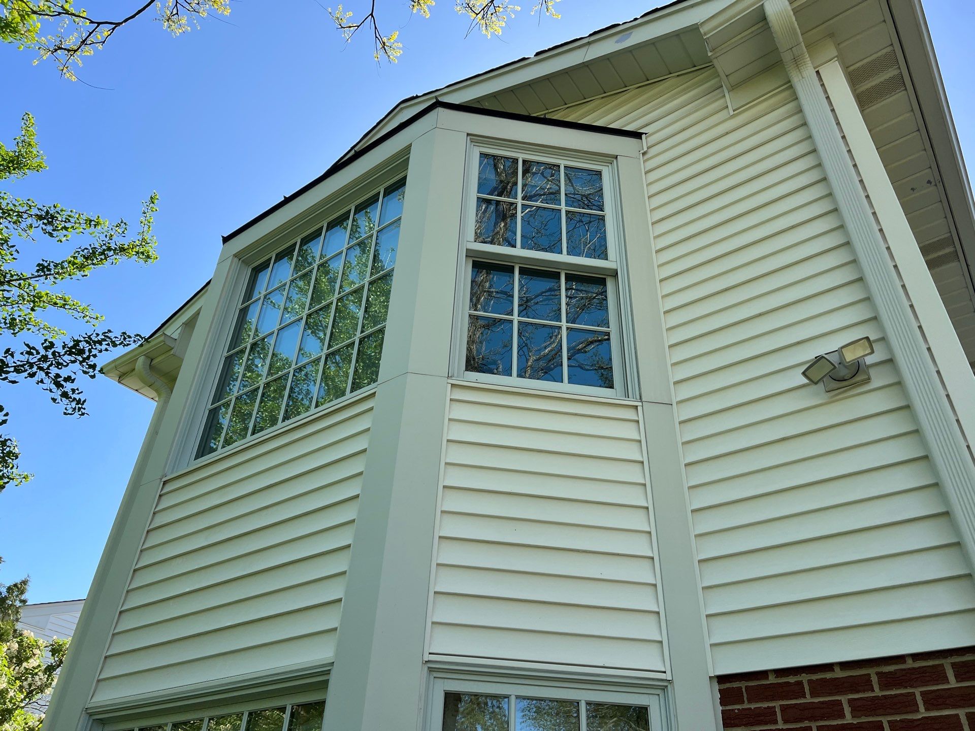 Housewashing  using Algaecide, soft wash soap by Northern Power Washing LLC.