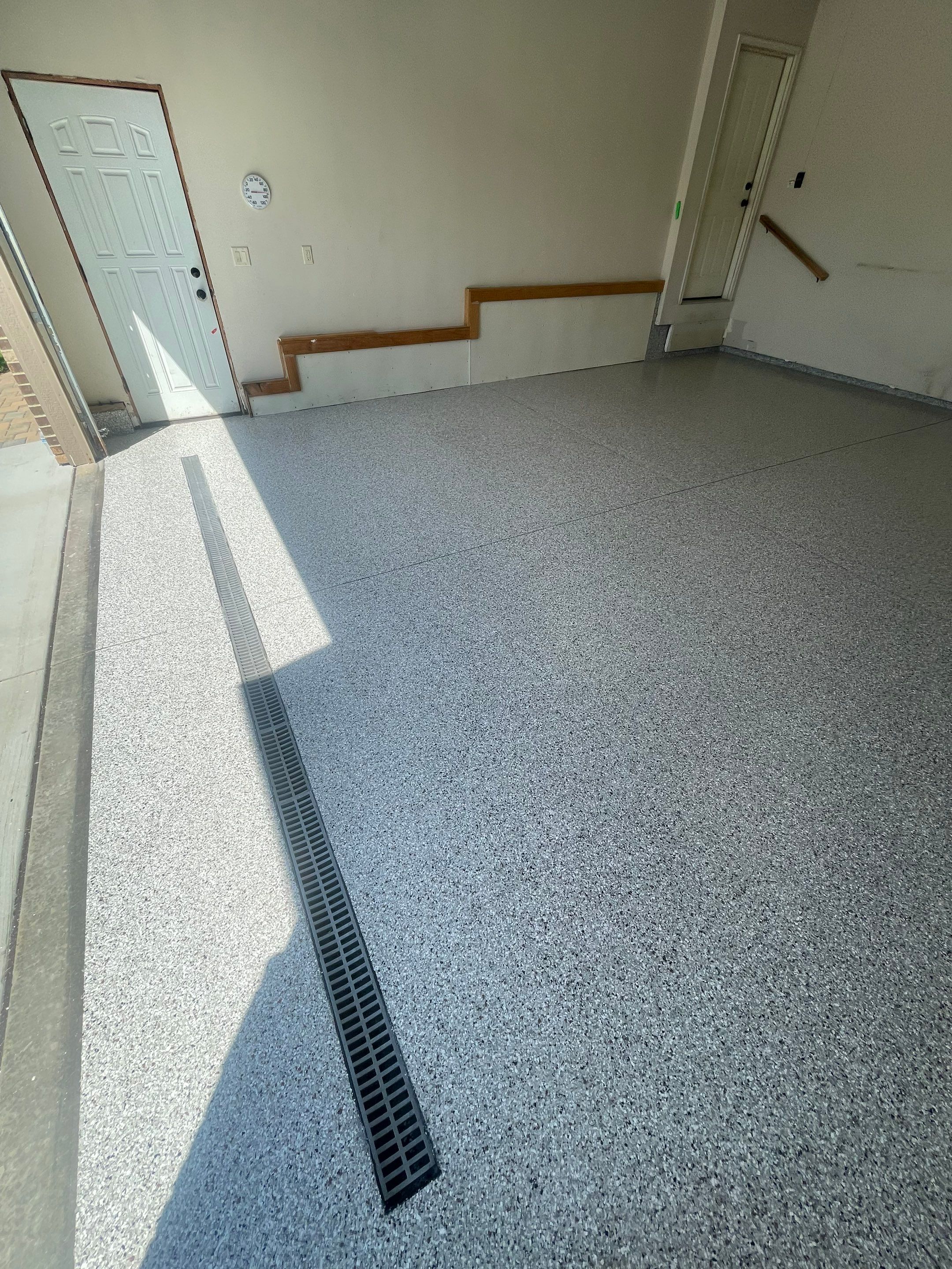 Multi-Stall Garage Floor Coating Installation in Sioux Falls by Select Painting, Coatings & Garage Cabinets