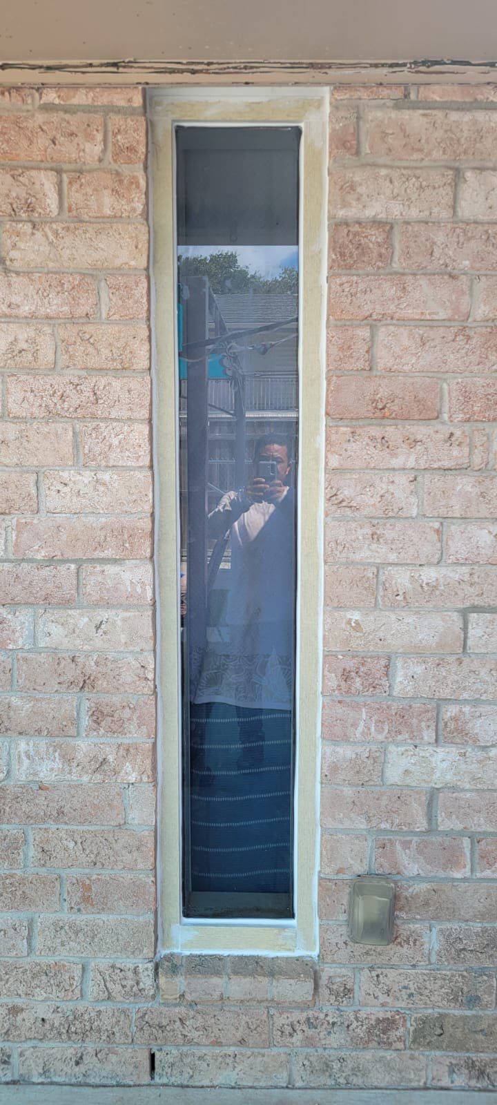 Colored Vinyl Windows to blend into brick by Bayfront Roofing and Construction
