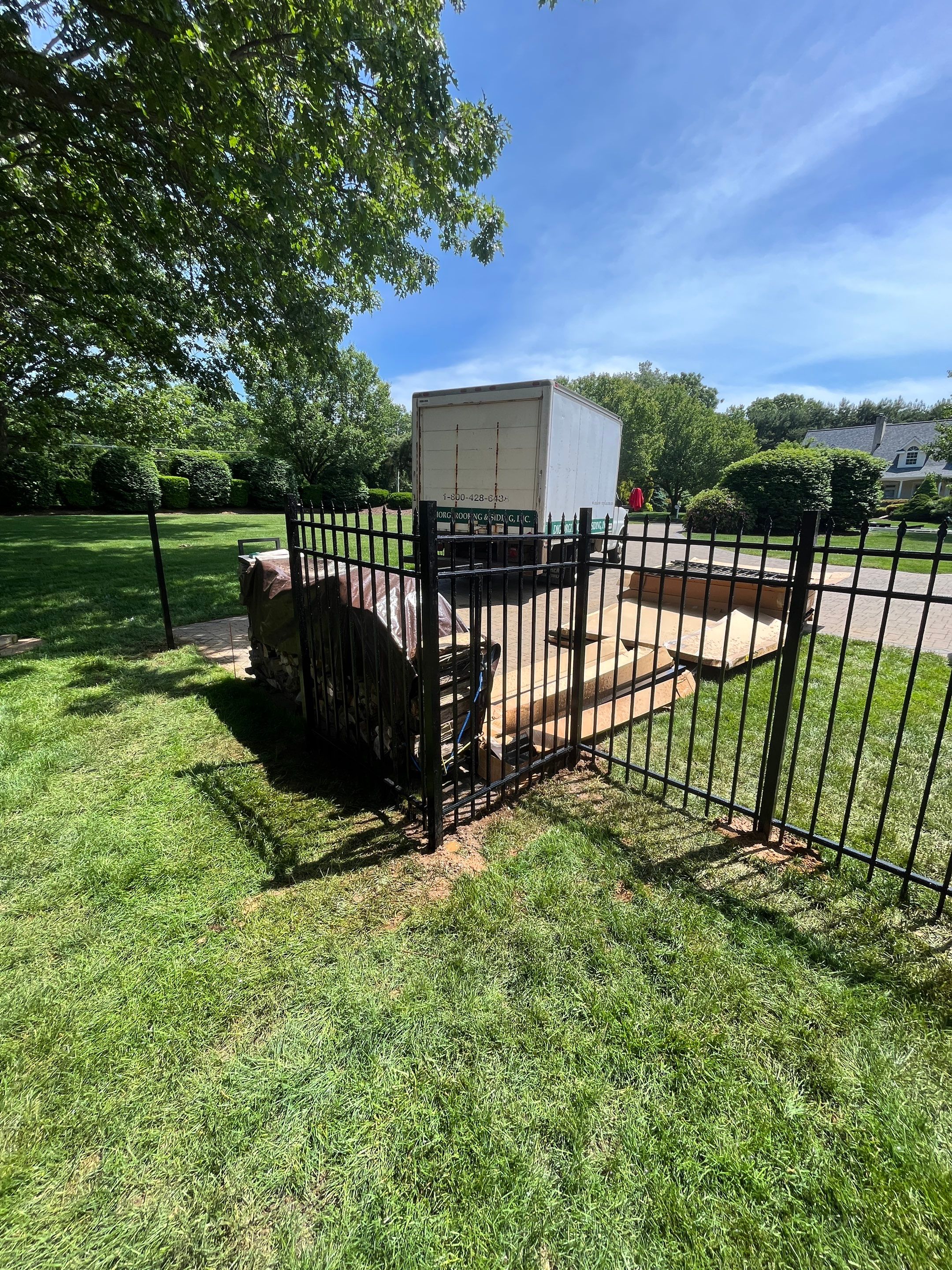 New Black Aluminum fence with matching gate by DiGiorgi Roofing and Siding Inc