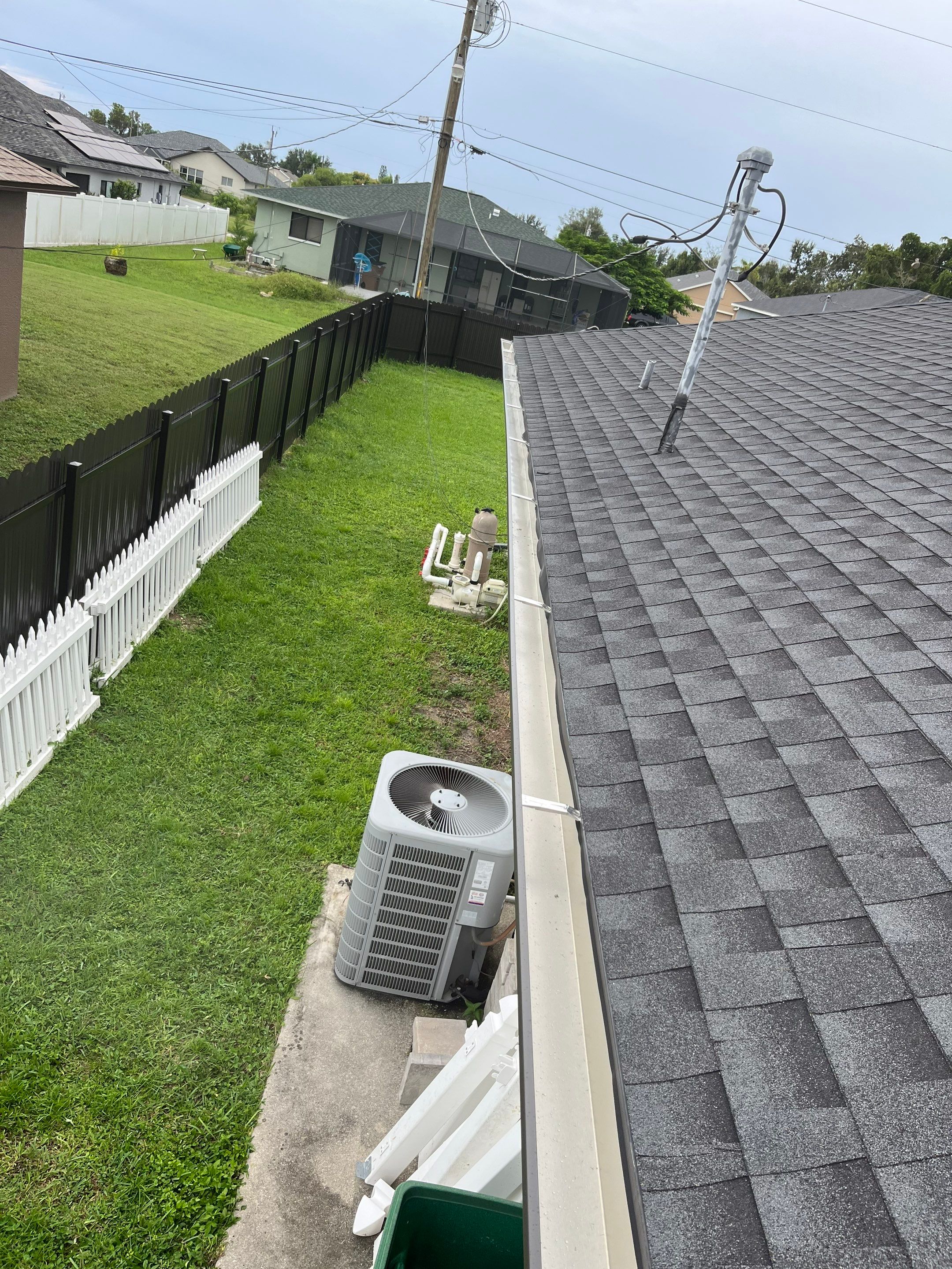 Black Seamless Gutters for a Modern Look in Cape Coral FL by Gutter Professors