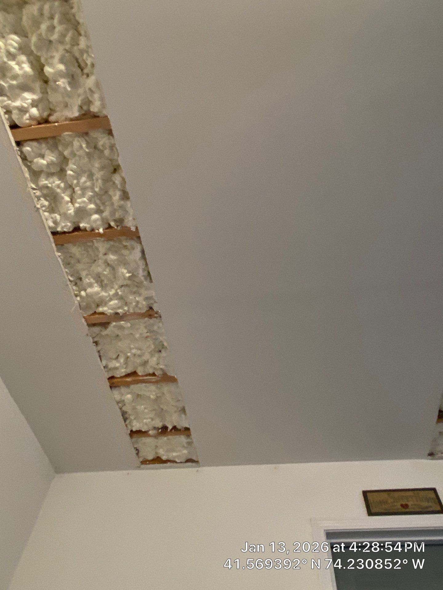 Garage ceiling using open cell spray foam by NYS Foam & Energy