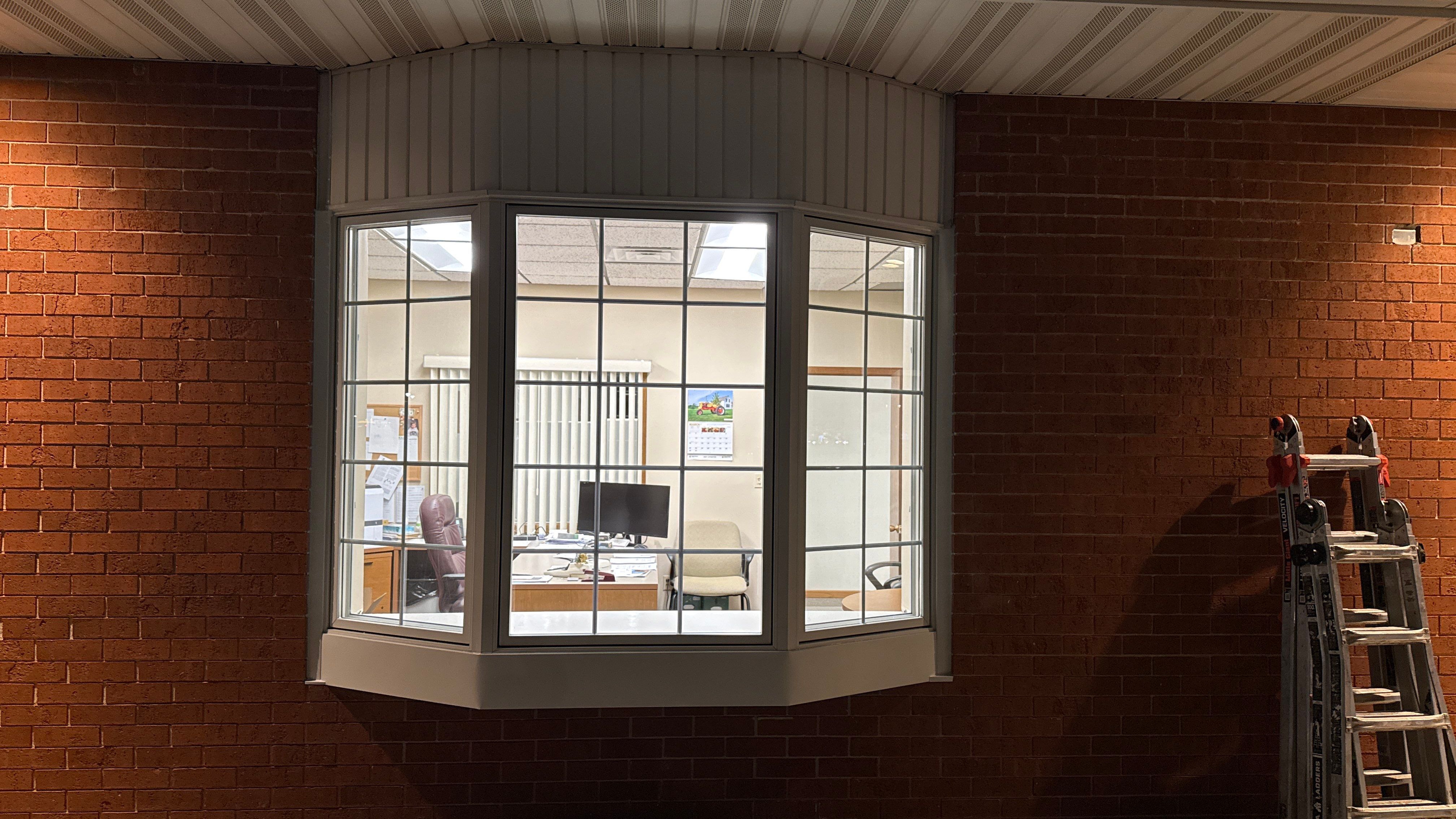 Pella Window installation using Pella Lifestyle wood/Aluminum window by United Windows and Siding LLC