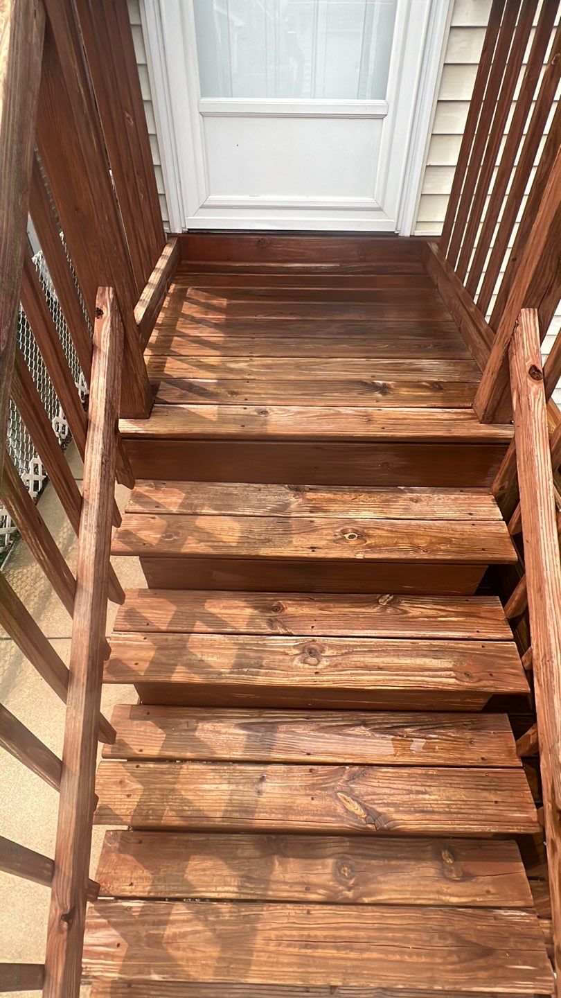 Wood cleaning and staining using Armstrong cloark oil stain by Northern Power Washing LLC.