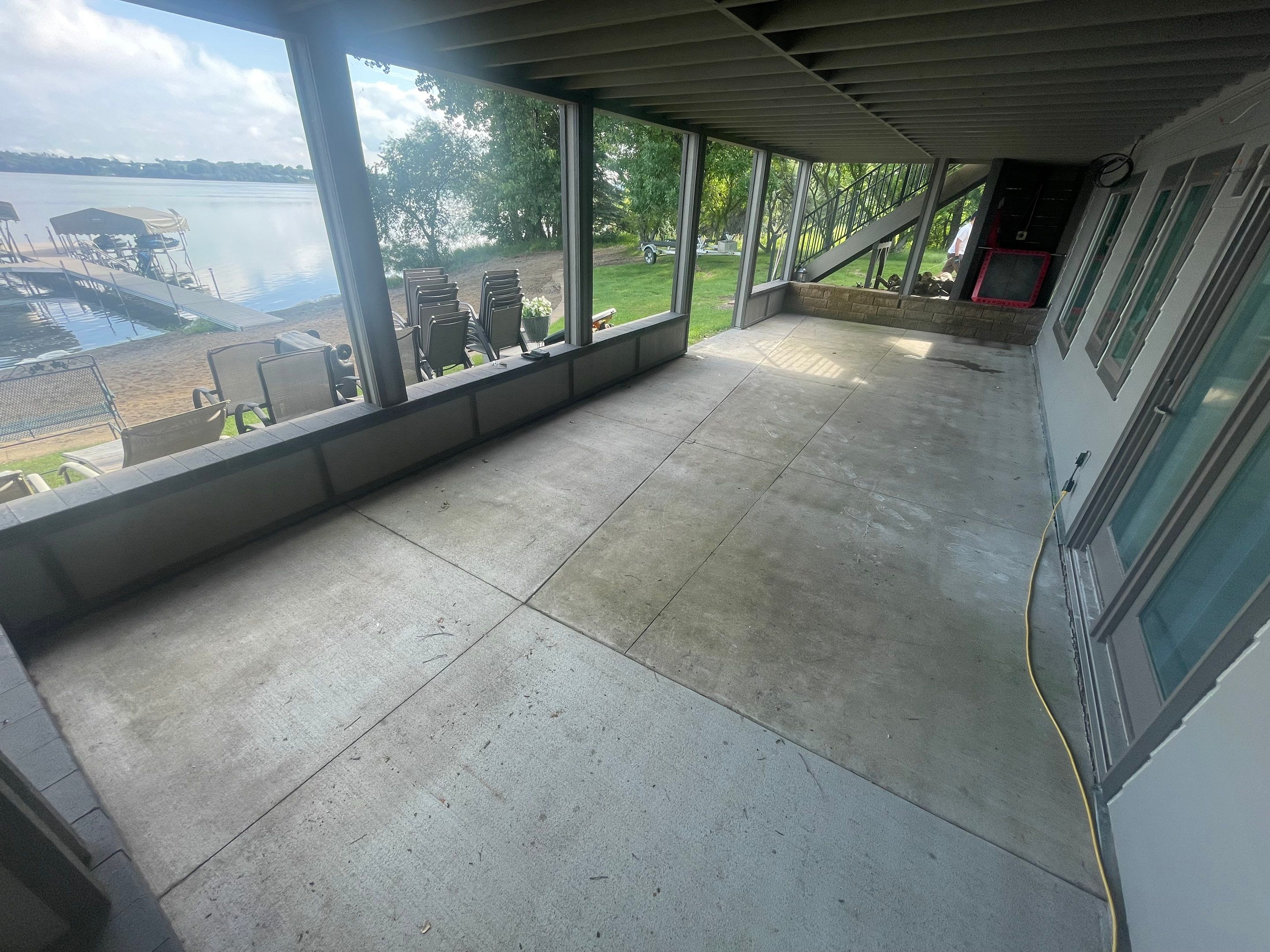 Lakefront Screened Patio Concrete Coating Installation in Wentworth by Select Painting, Coatings & Garage Cabinets