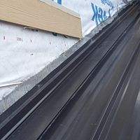 24ga 1.5" Mechanical Seam Dark Bronze by Total Roofing System The Metal Roof Experts