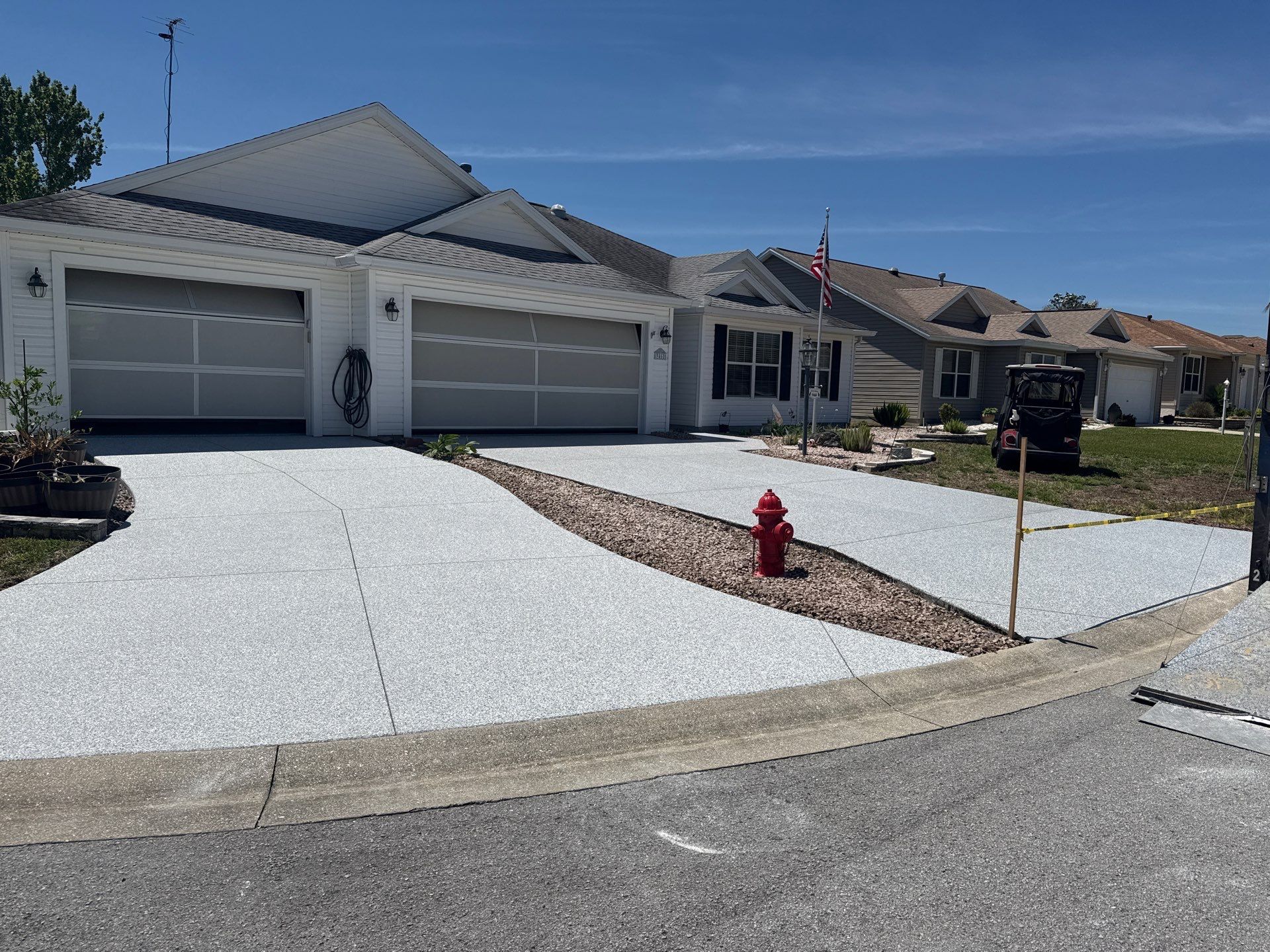 Garage, Drivewat, and Sidewalk in Landshark and Tidalwave by Innovative Concrete Coatings 