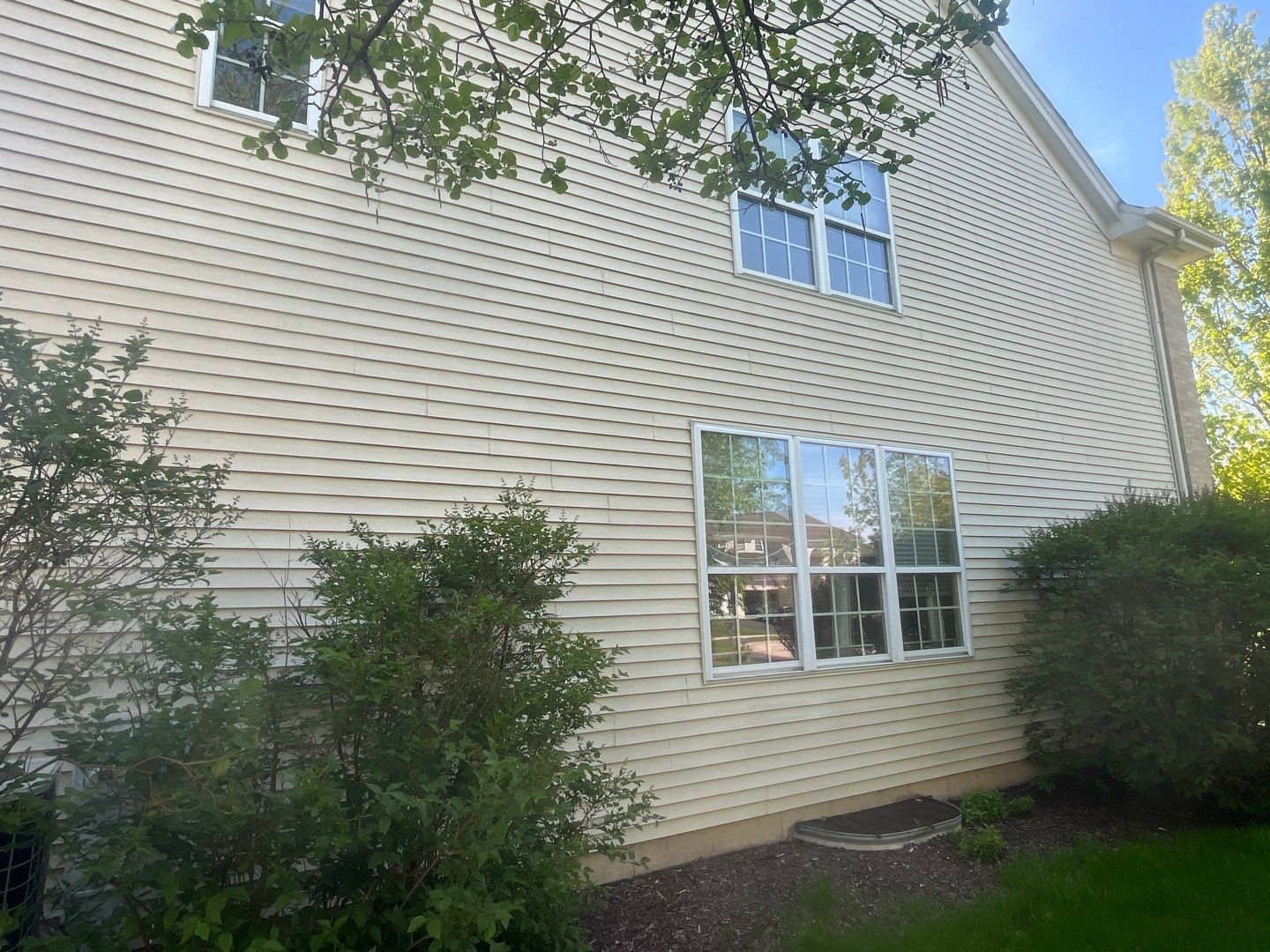 Housewashing  using Algaecide, soft wash soap by Northern Power Washing LLC.
