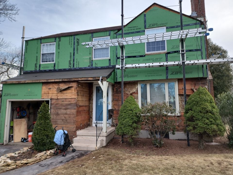 James Hardie siding, new metal roof and couple windows being installed. by UBrothers Construction