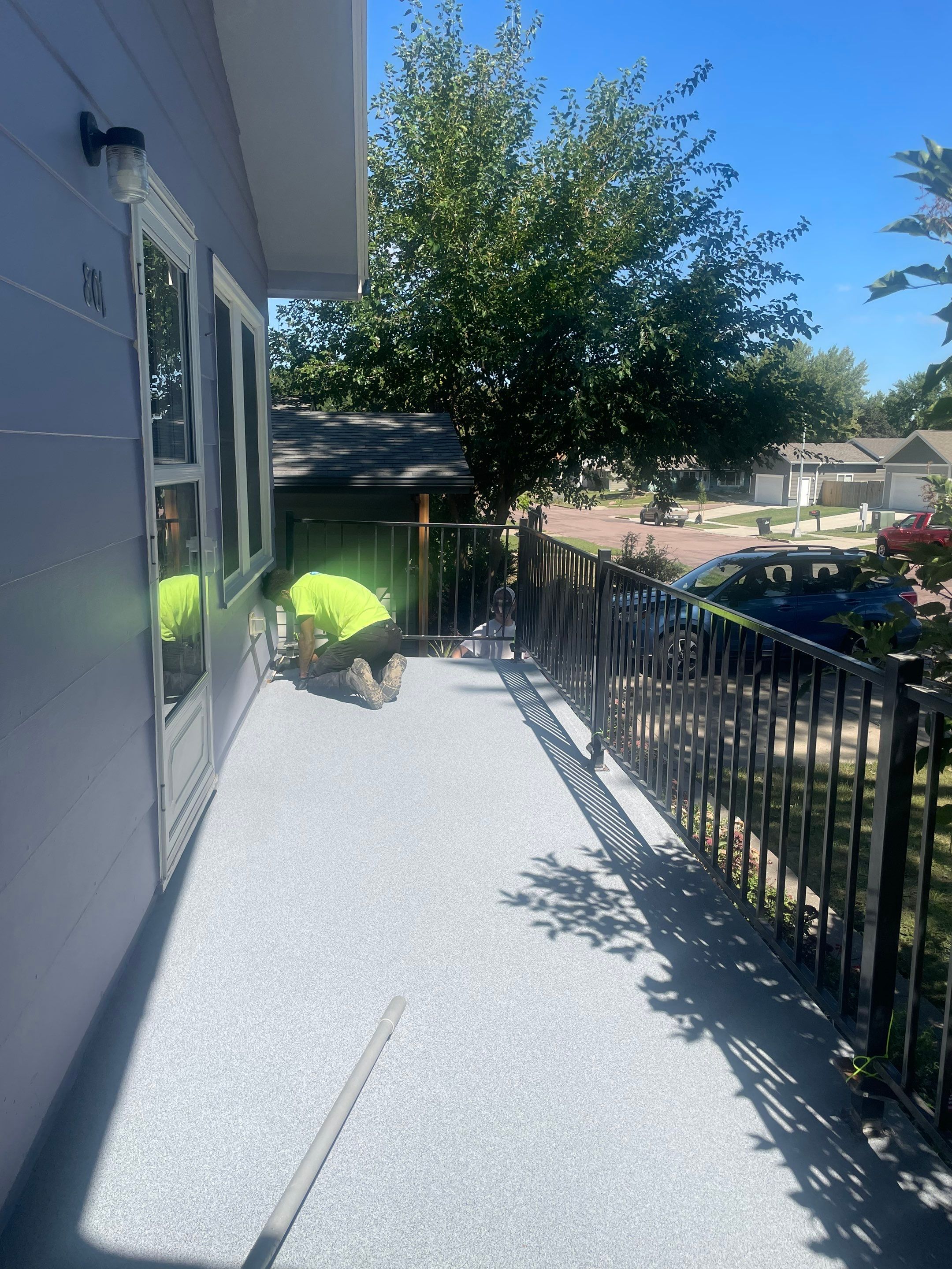 Sioux Falls Concrete Porch Coating with Starry Evening Finish by Select Painting, Coatings & Garage Cabinets