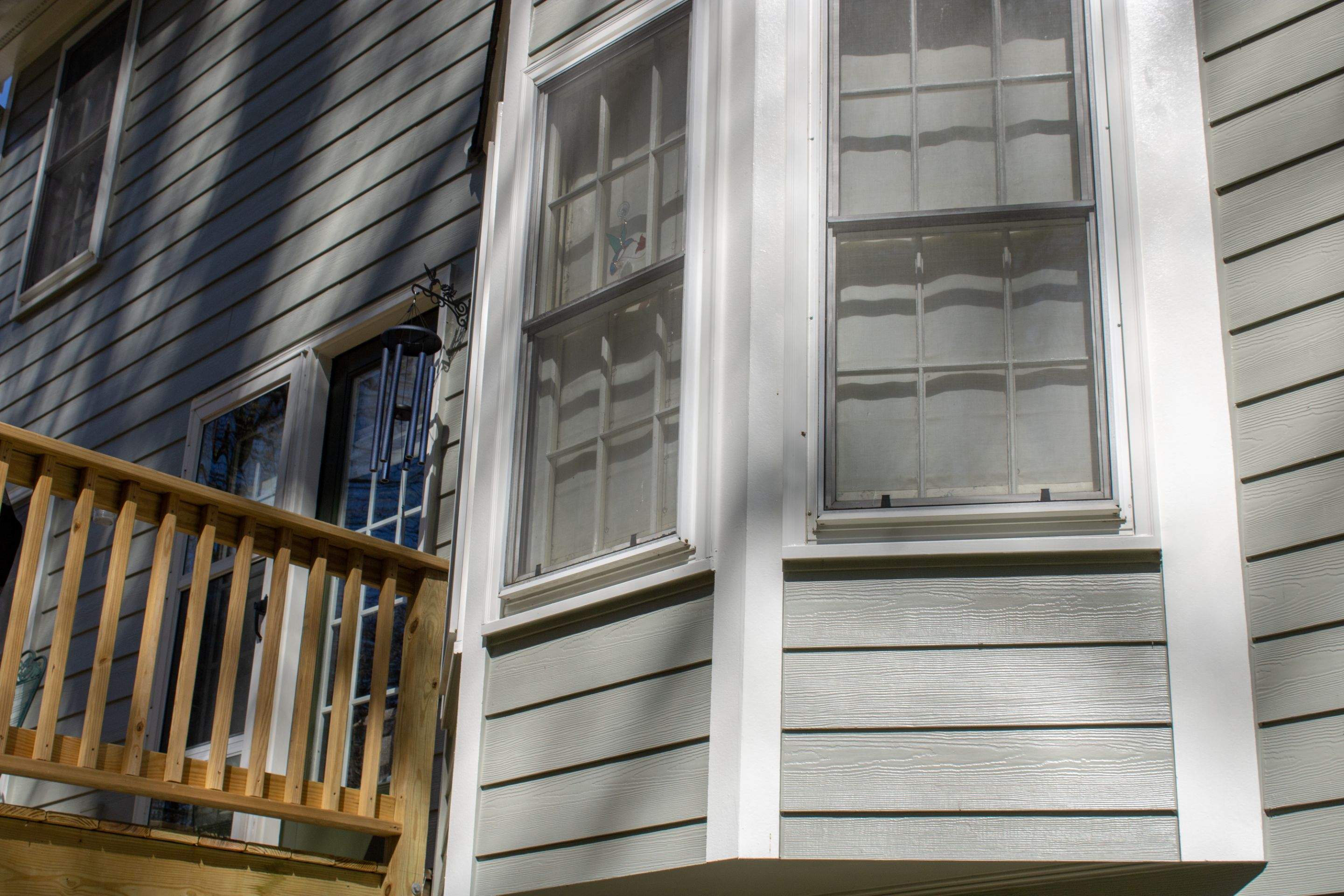 James Hardie Siding Replacement and Pressure Treated Pine Deck Resurface  by Nelson Exteriors 