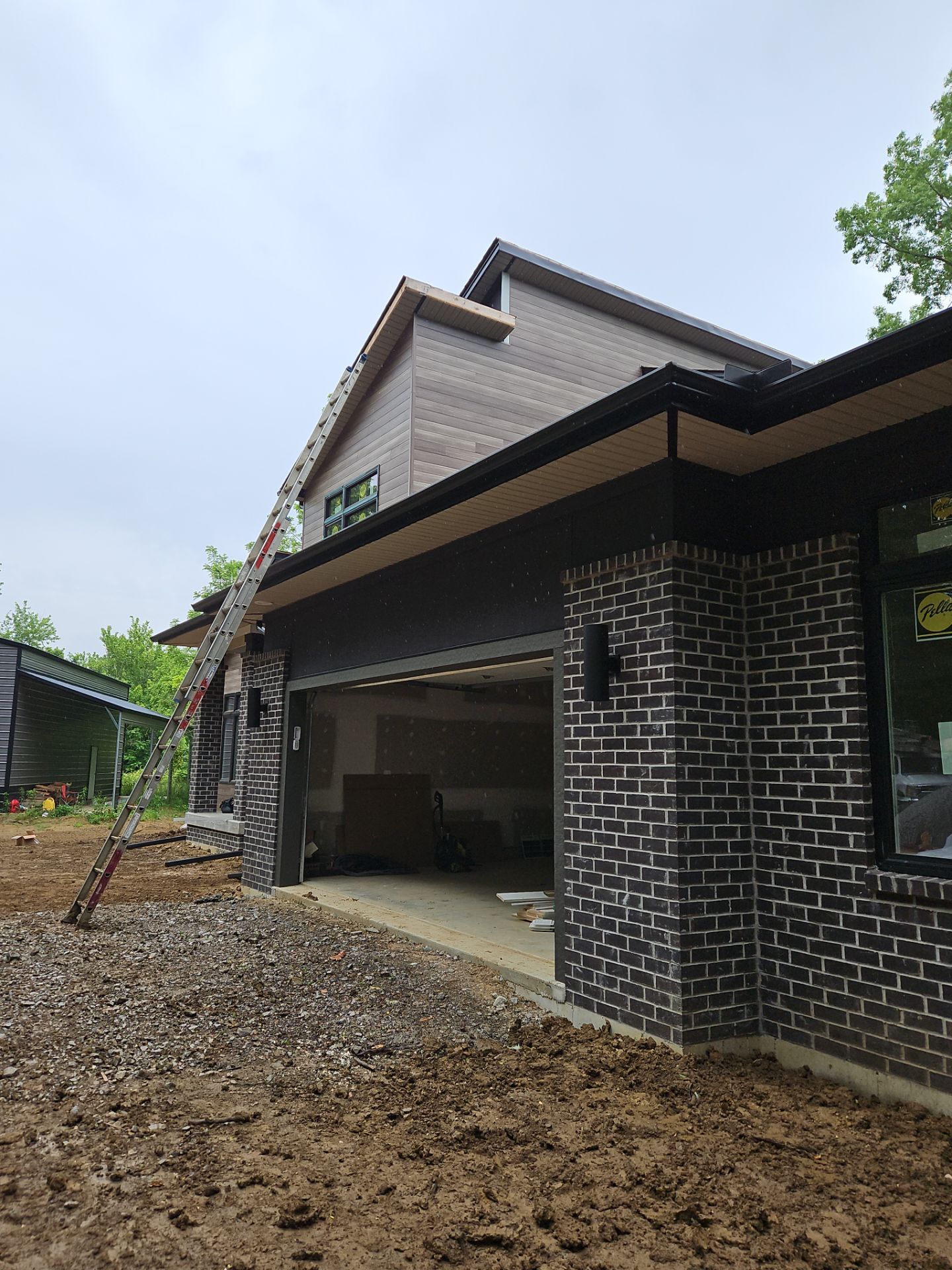 Gutter Installation using 5" Seamless Gutters and Downspouts by RoofX 