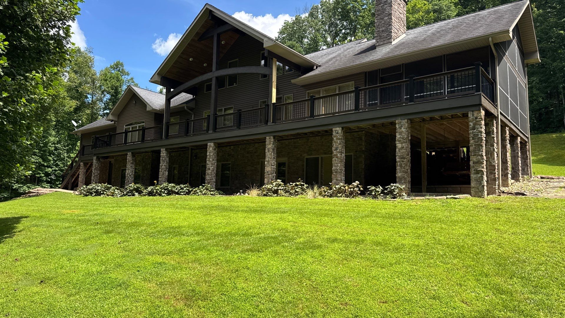 Custom Composite Deck Construction with Stone Pillars in Fayetteville