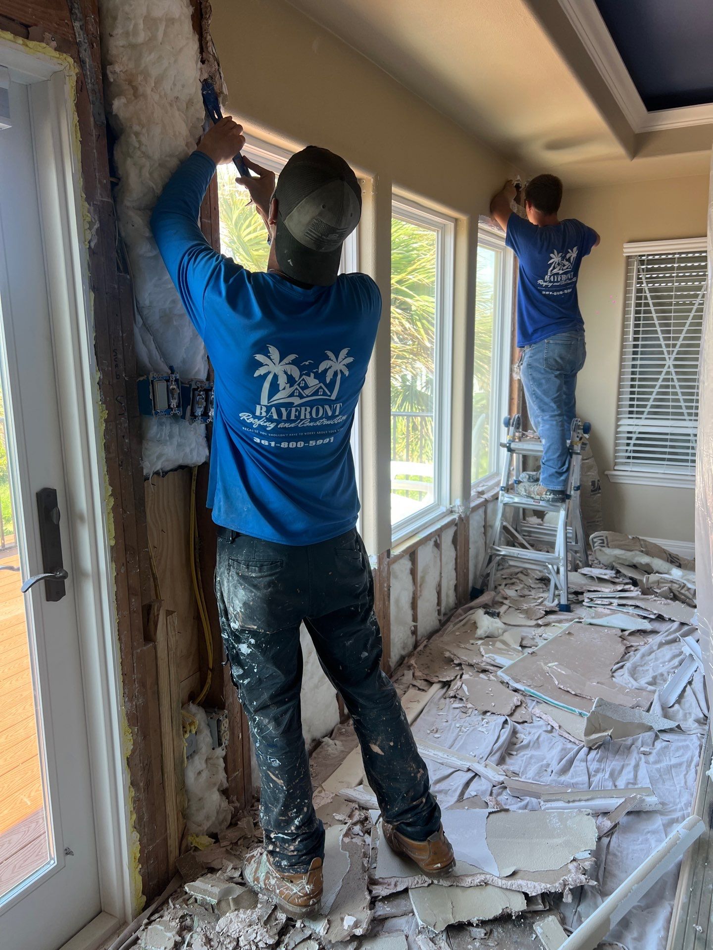 Installing Windows on a Submarine  by Bayfront Roofing and Construction