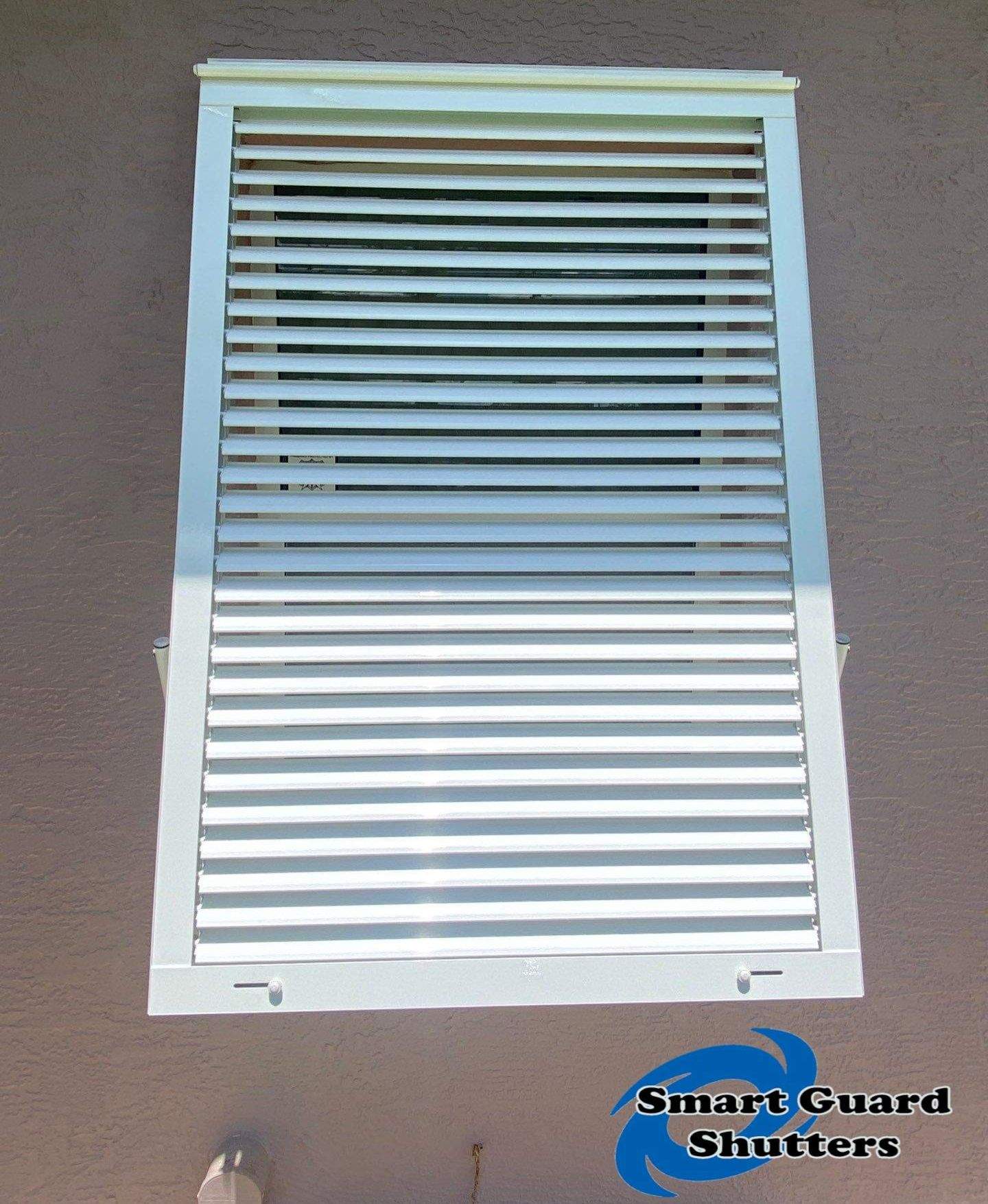 Impact Bahama Shutters in Signal White by Smart Guard Shutters