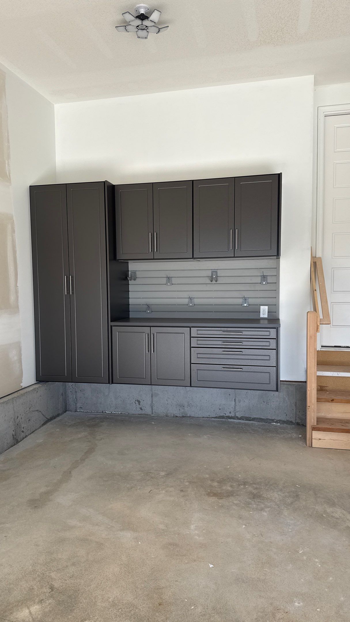 Nice Clean Look With These Pewter Cabinets by Banner Garage