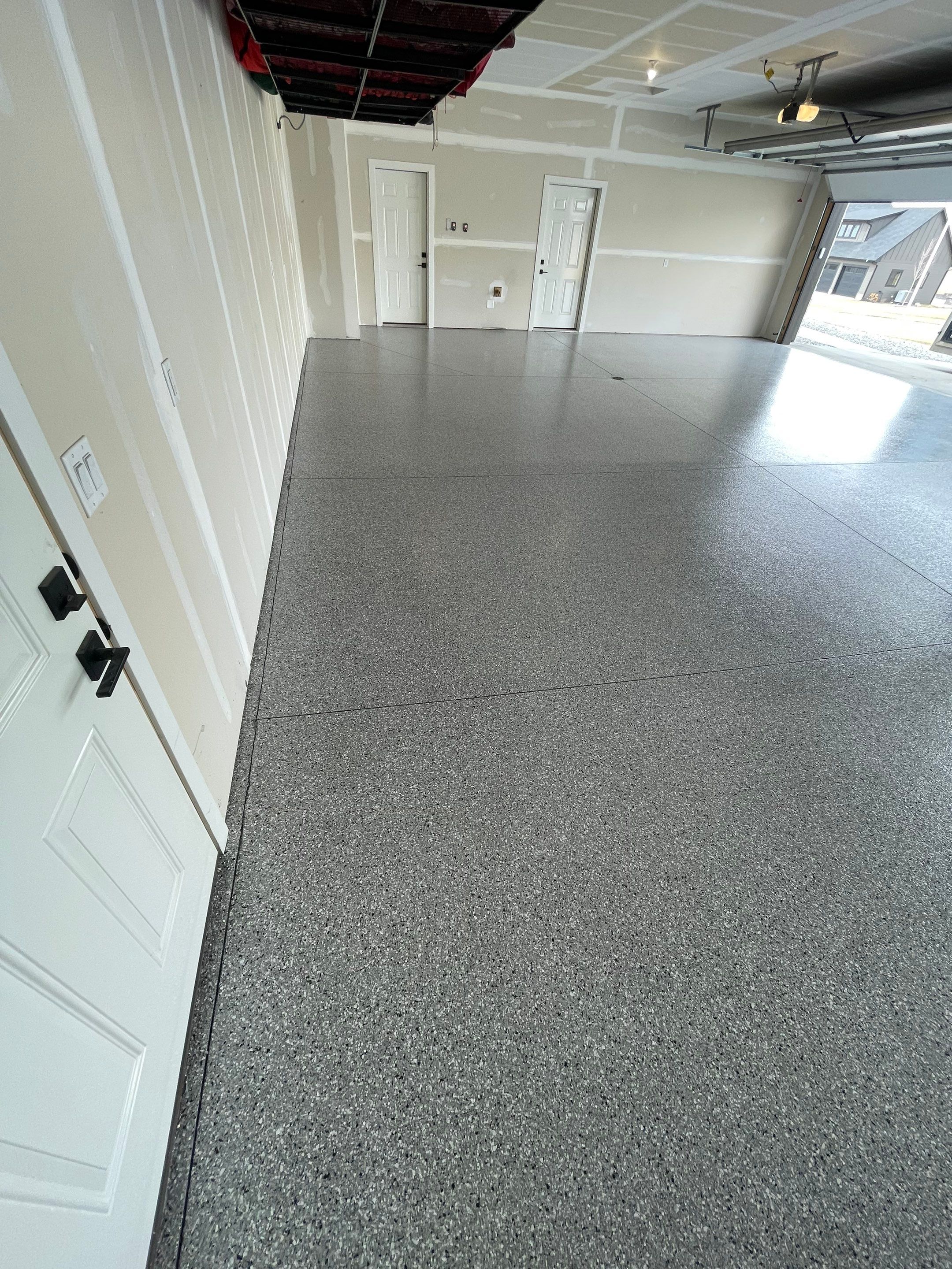 Grey Speckled Epoxy Floor Coating for Sioux Falls Garage by Select Painting, Coatings & Garage Cabinets