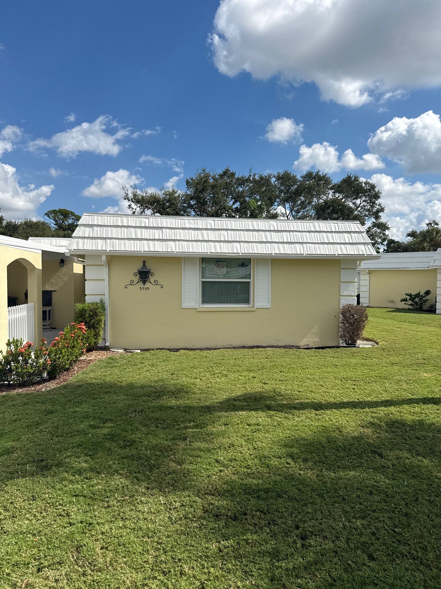 White Gutters and Matching Downspouts in Sarasota FL by Gutter Professors