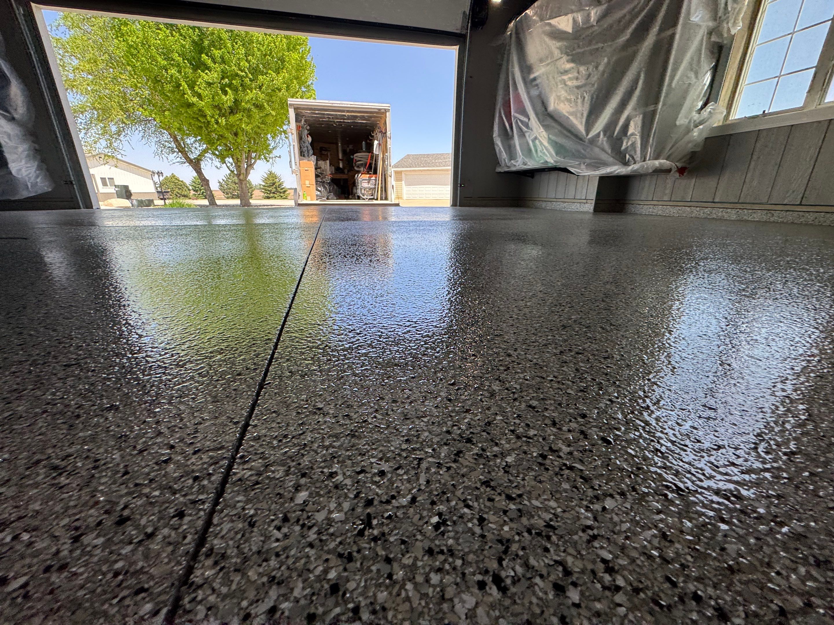 High-Gloss Grey Epoxy Floor Coating for Inwood Garage by Select Painting, Coatings & Garage Cabinets