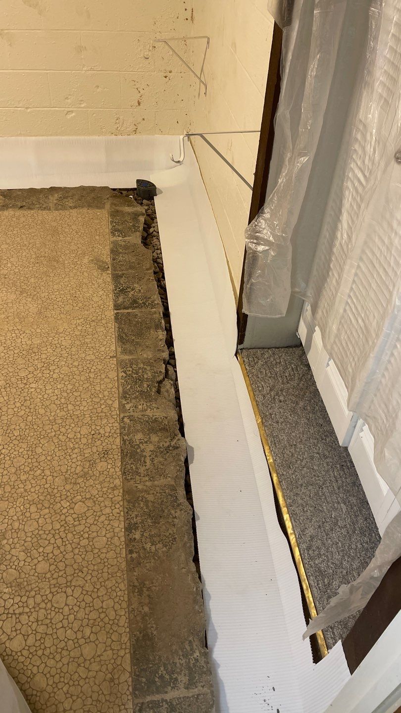 Interior Waterproofing Using GrateDrain™ Products by Toledo Basement Repair 