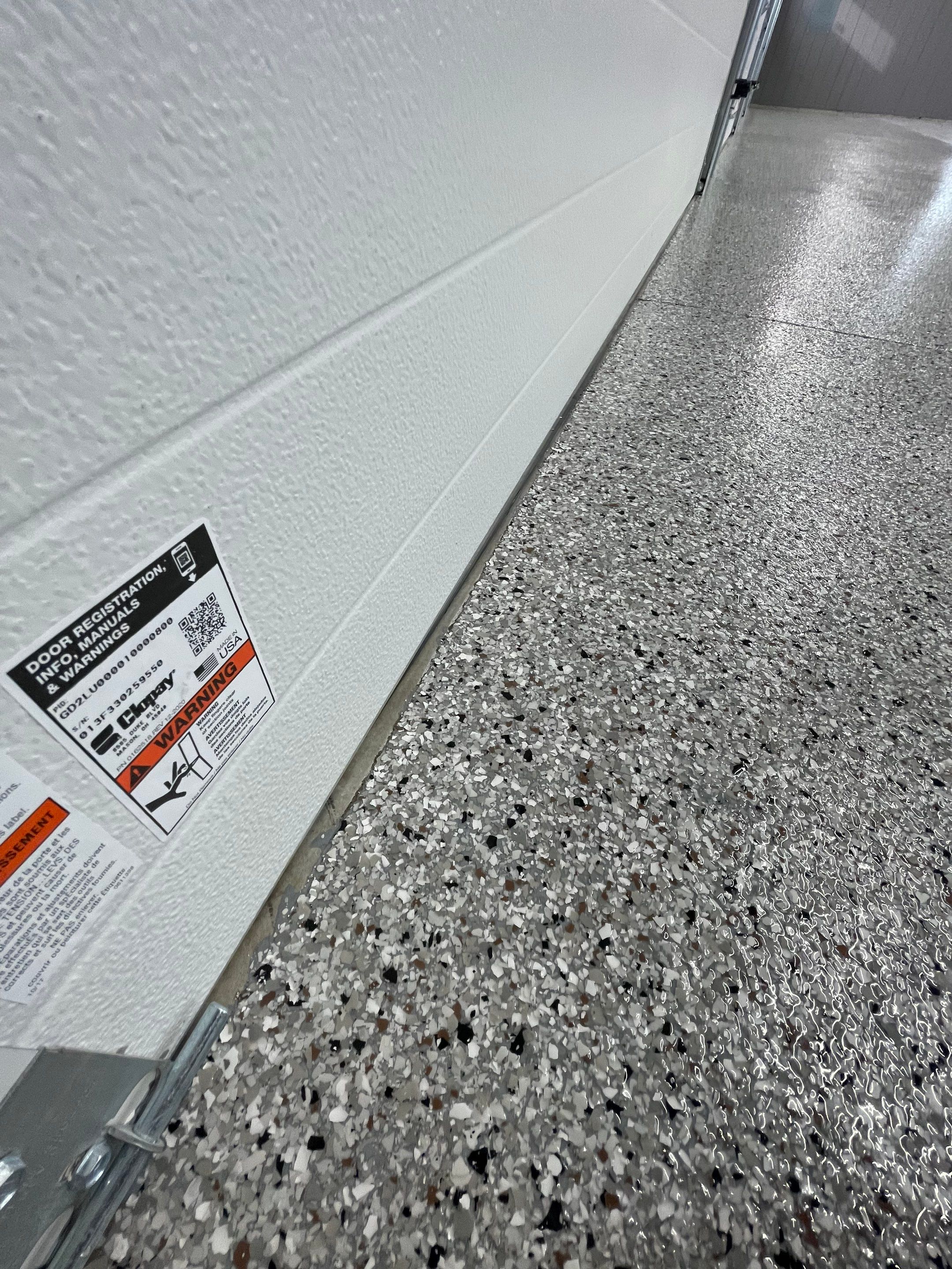 Speckled Epoxy Floor Coating for Large Shop in Rock Valley by Select Painting, Coatings & Garage Cabinets