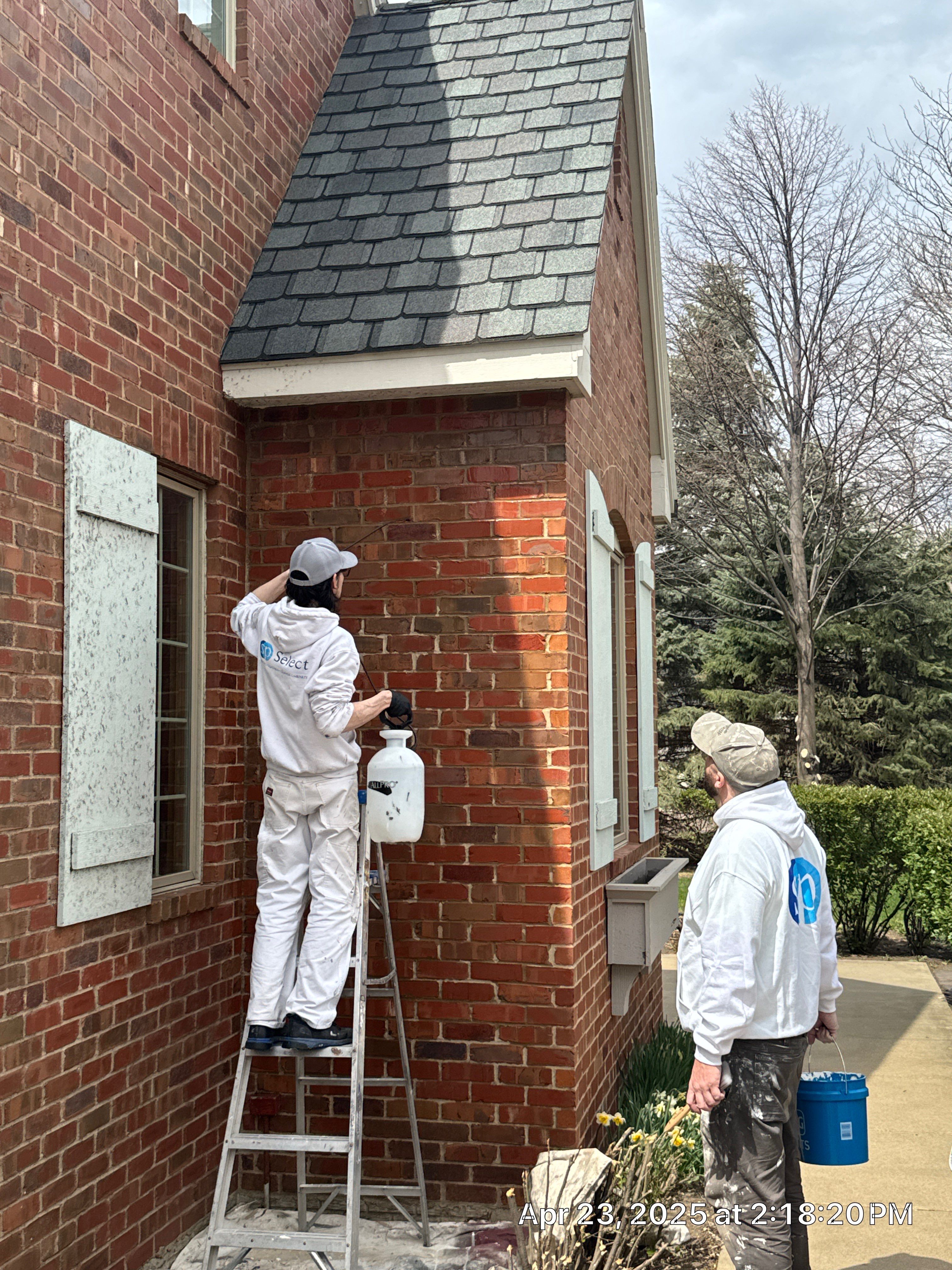 Residential Exterior Brick Painting and Limewash Refresh in Sioux Falls by Select Painting, Coatings & Garage Cabinets
