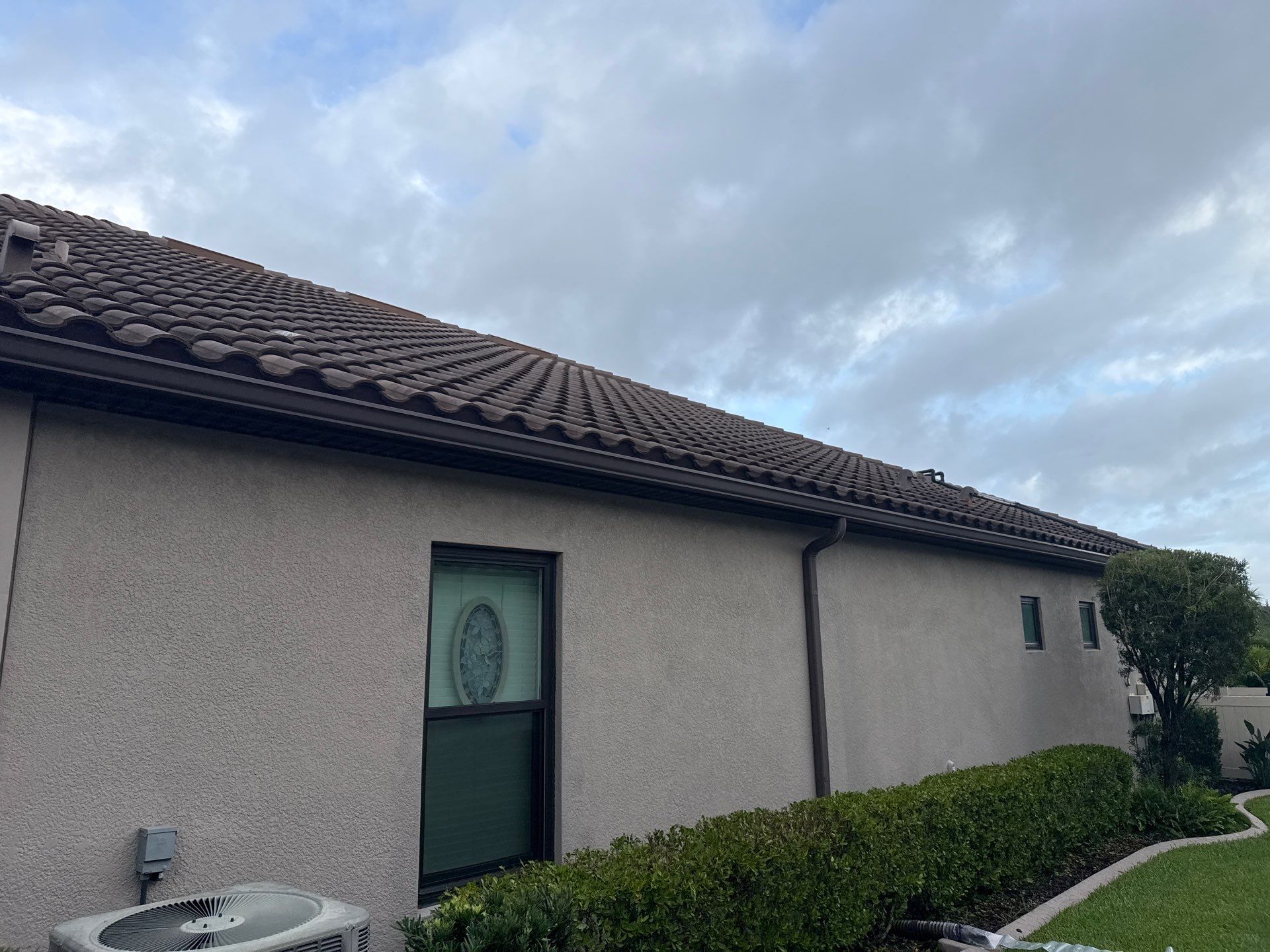 Neighboring Tile Roof Cleaning with Gutter Runoff Control – Palmetto, FL by Sunshine AquaWash