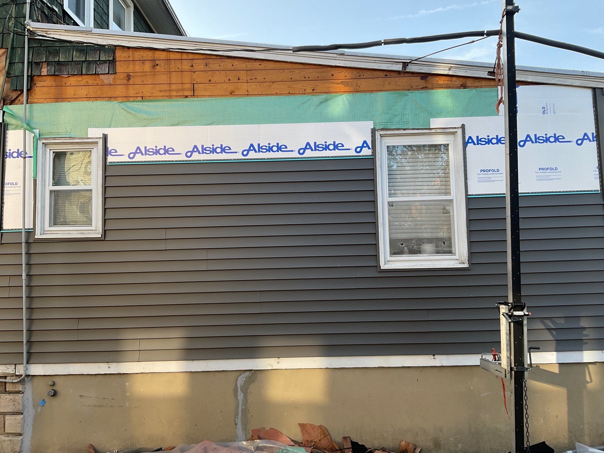 New siding & New Gutters by Alpha Design Services