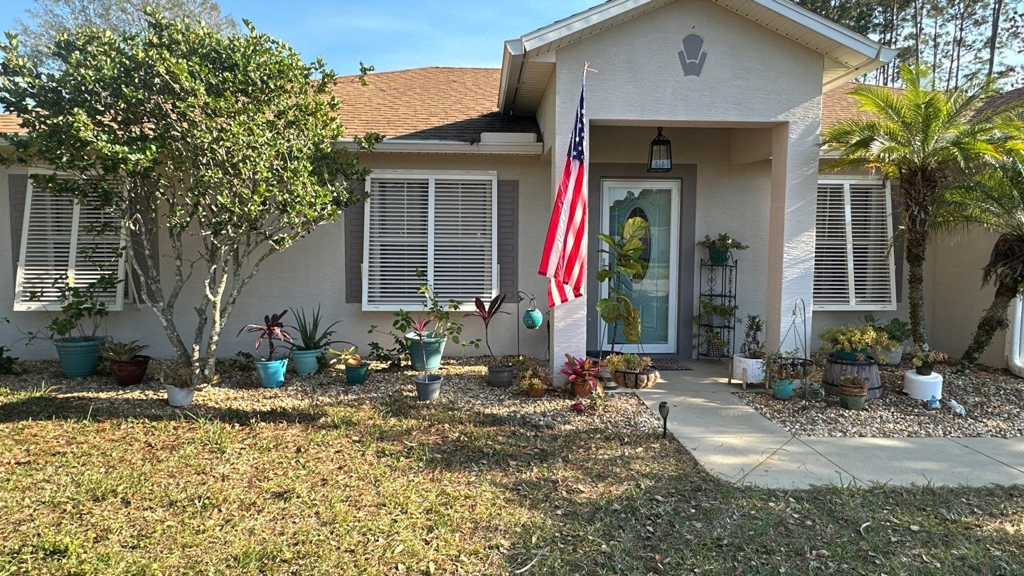 Hurricane Rated Bahama Shutters in Cream by Smart Guard Shutters