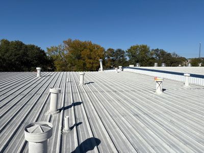 Wide angle view of a completed corrugated metal roof