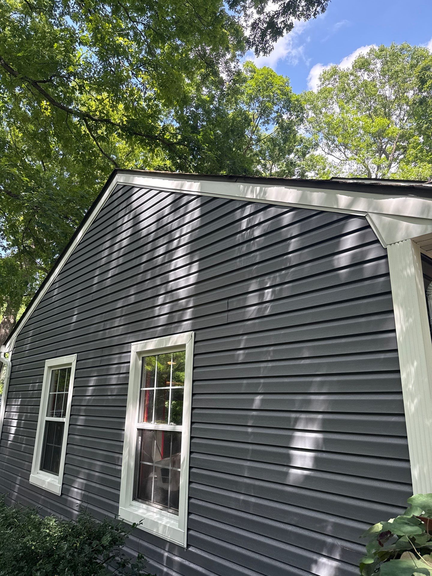 Vinyl Siding and Exterior Trim Repair for Brighton Residence by Top Shelf Painter