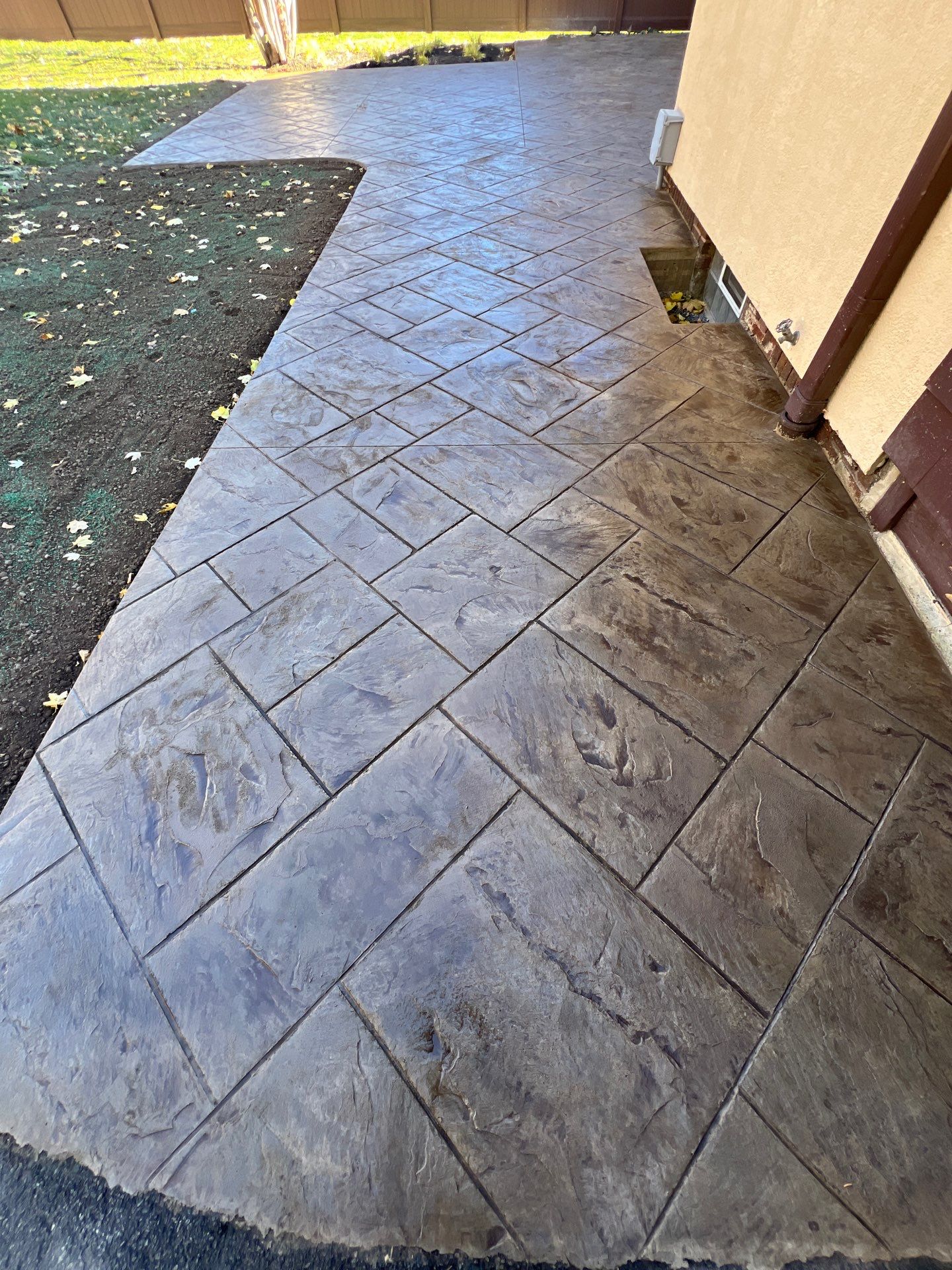 Majestic Ashlar stamped concrete patio  by NG Masonry & Construction LLC